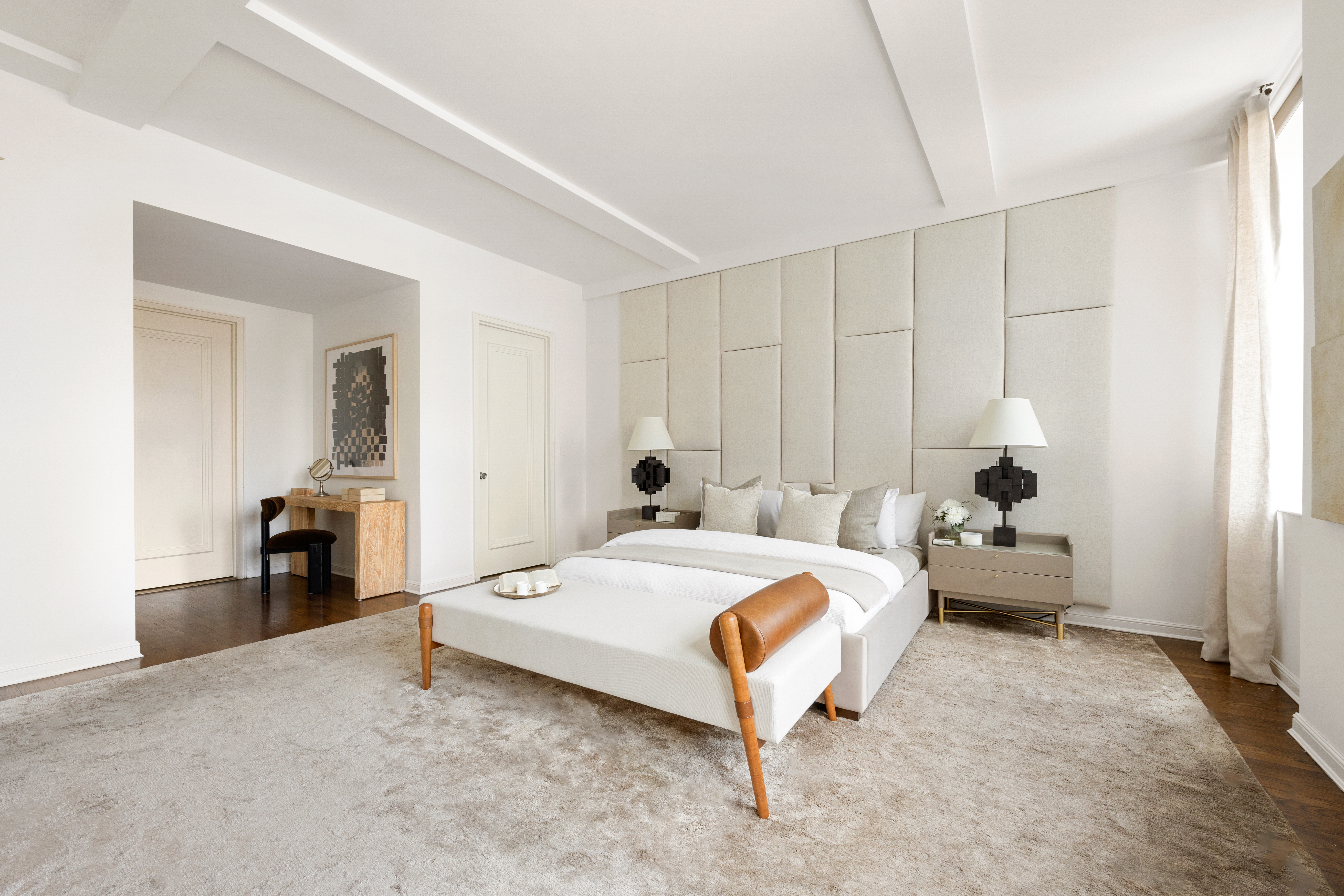 252 7th Avenue, Unit 17I Manhattan, NY 10001 - Photo 10 of 17 a bedroom with a bed and a chandelier