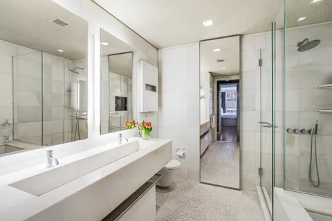 a bathroom with a double vanity sink mirror and double