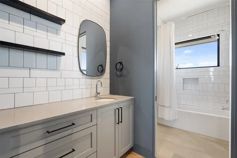 an empty room with floor to ceiling window