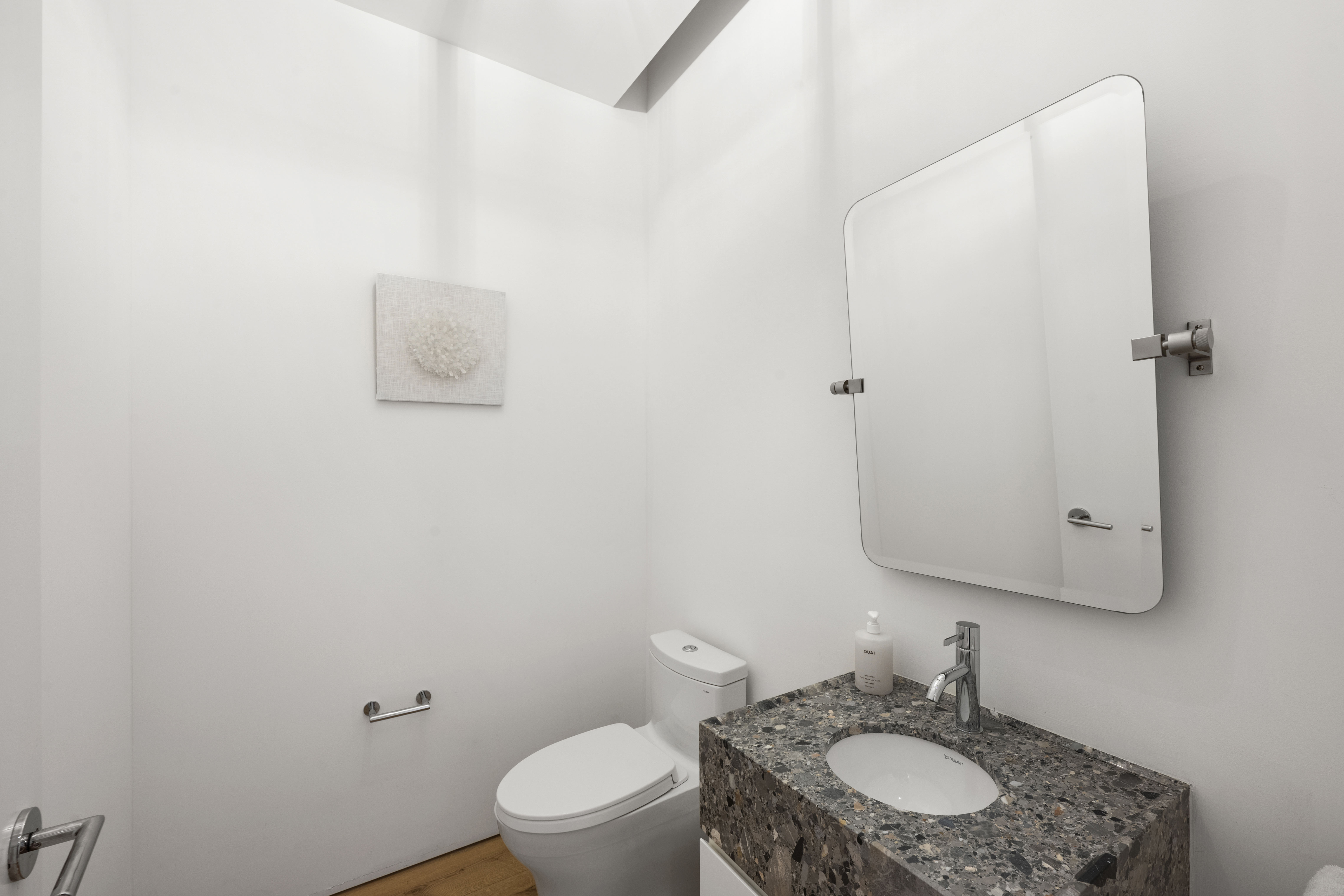 532 West 20th Street, Unit 4 Manhattan, NY 10011 - Photo 18 of 23 a bathroom with a granite countertop toilet and a sink