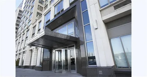 a room with gym equipment and a large window
