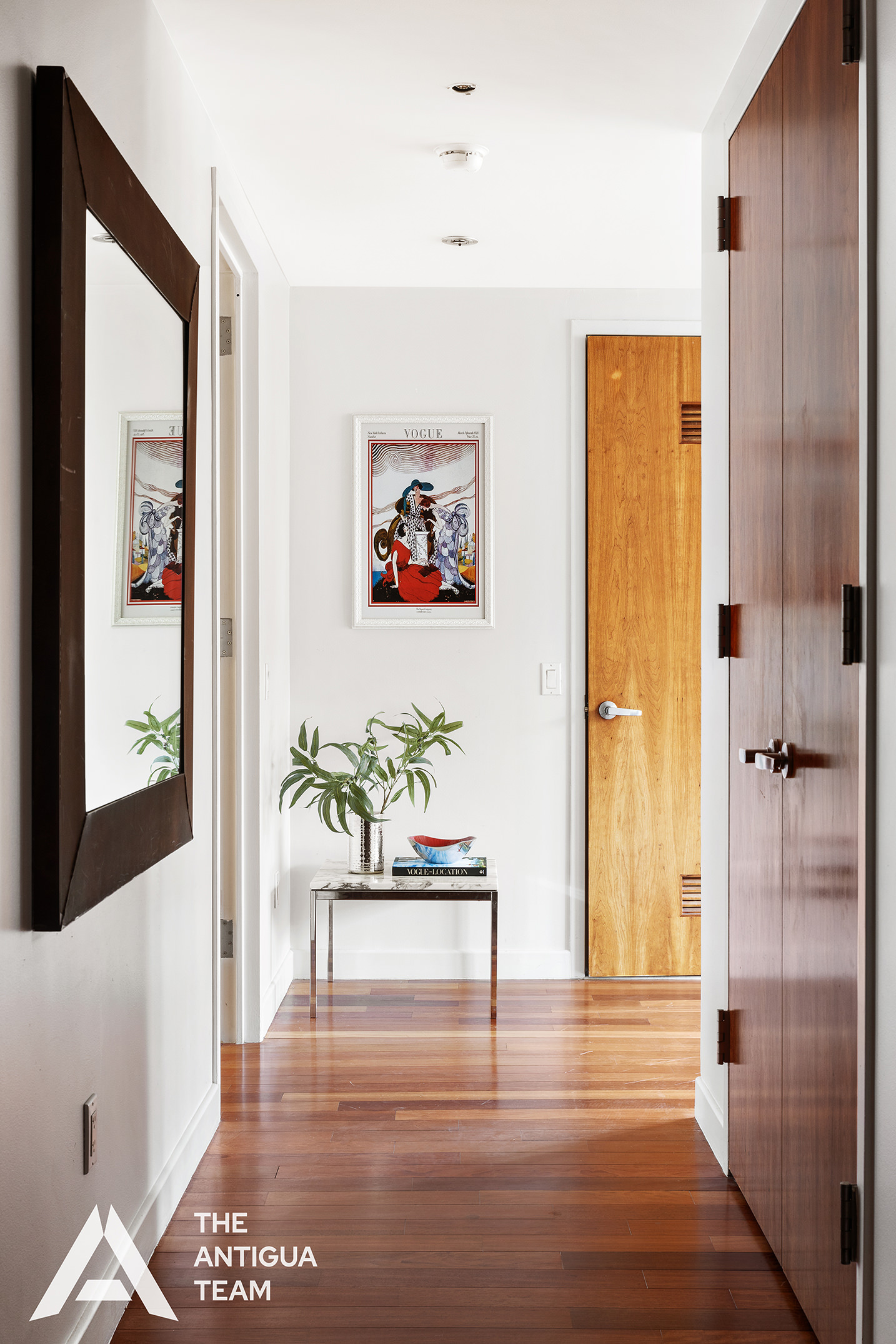 125 West 21st Street, Unit 12A Manhattan, NY 10011 - Photo 11 of 16 a view of a hallway with wooden floor and a dining room