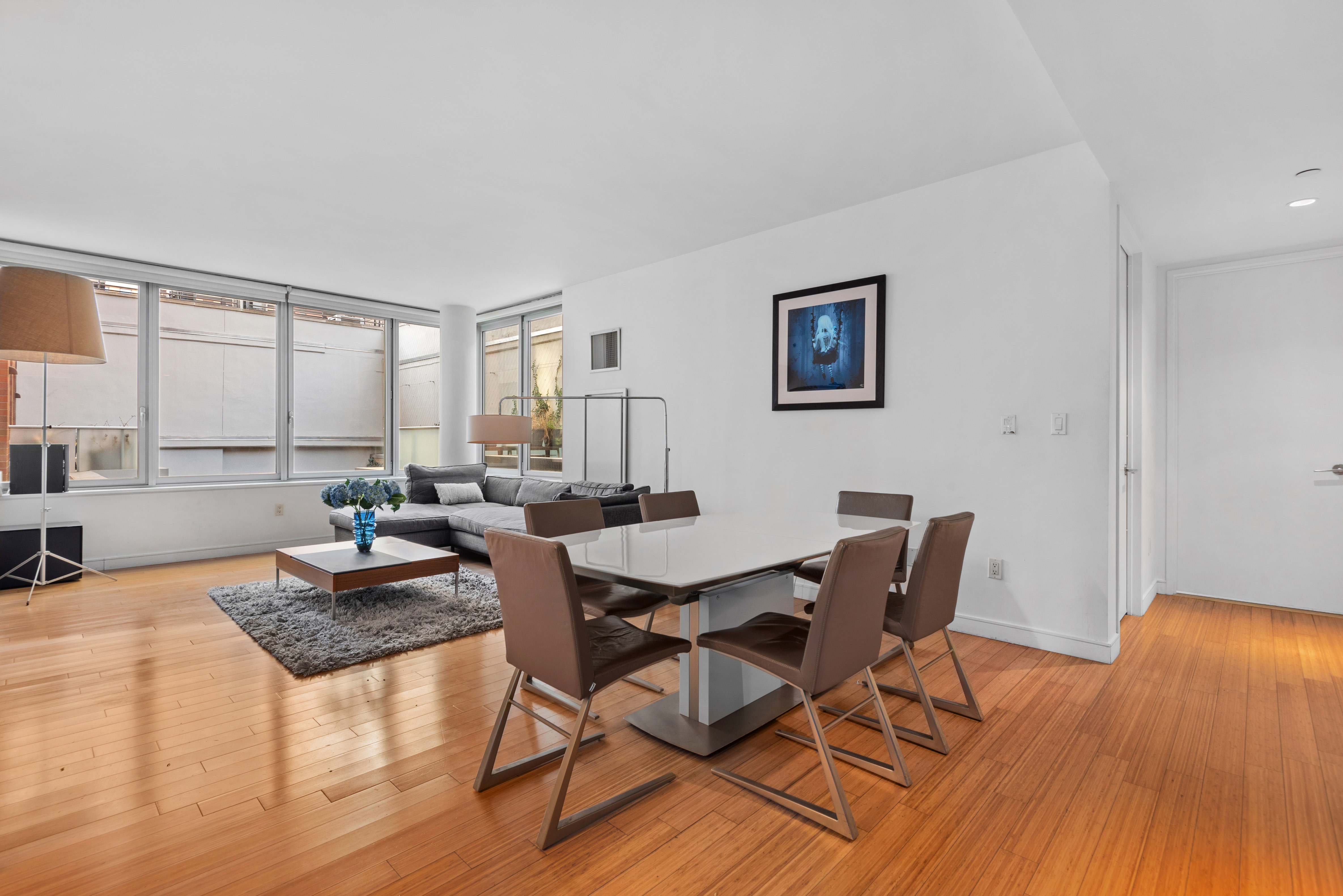 303 East 33rd Street, Unit B2 Manhattan, NY 10016 - Photo 2 of 24 a view of a dining room with furniture and wooden floor