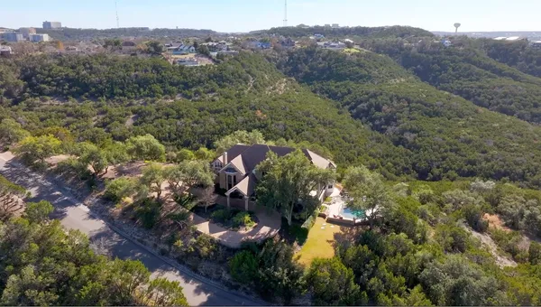 an aerial view of residential house with outdoor space and mountain view