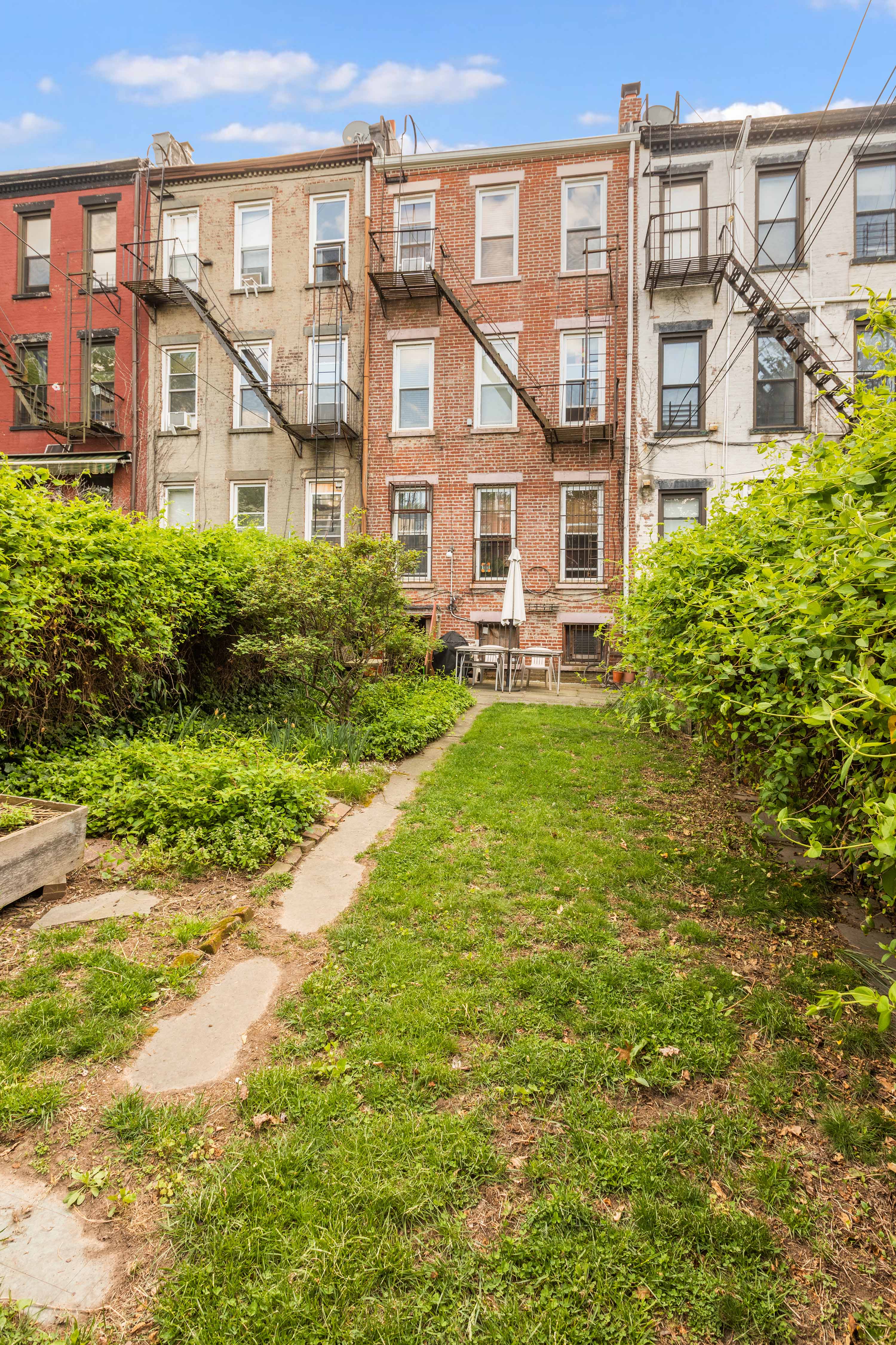 449 11th Street Brooklyn, NY 11215 - Photo 14 of 17 a view of a big yard with large tree and plants