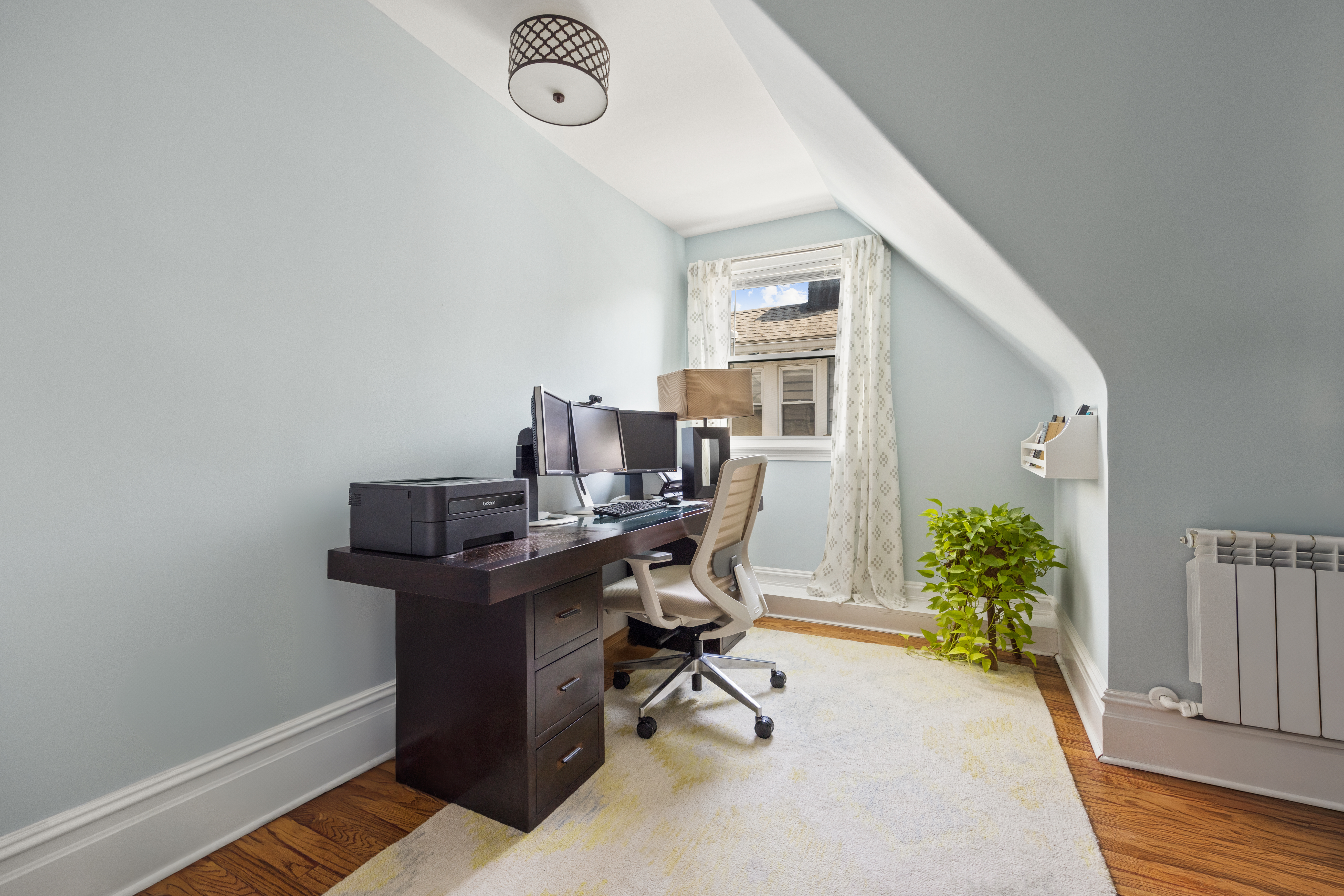 758 Westminster Road Brooklyn, NY 11230 - Photo 19 of 32 a view of a workspace with furniture and a window