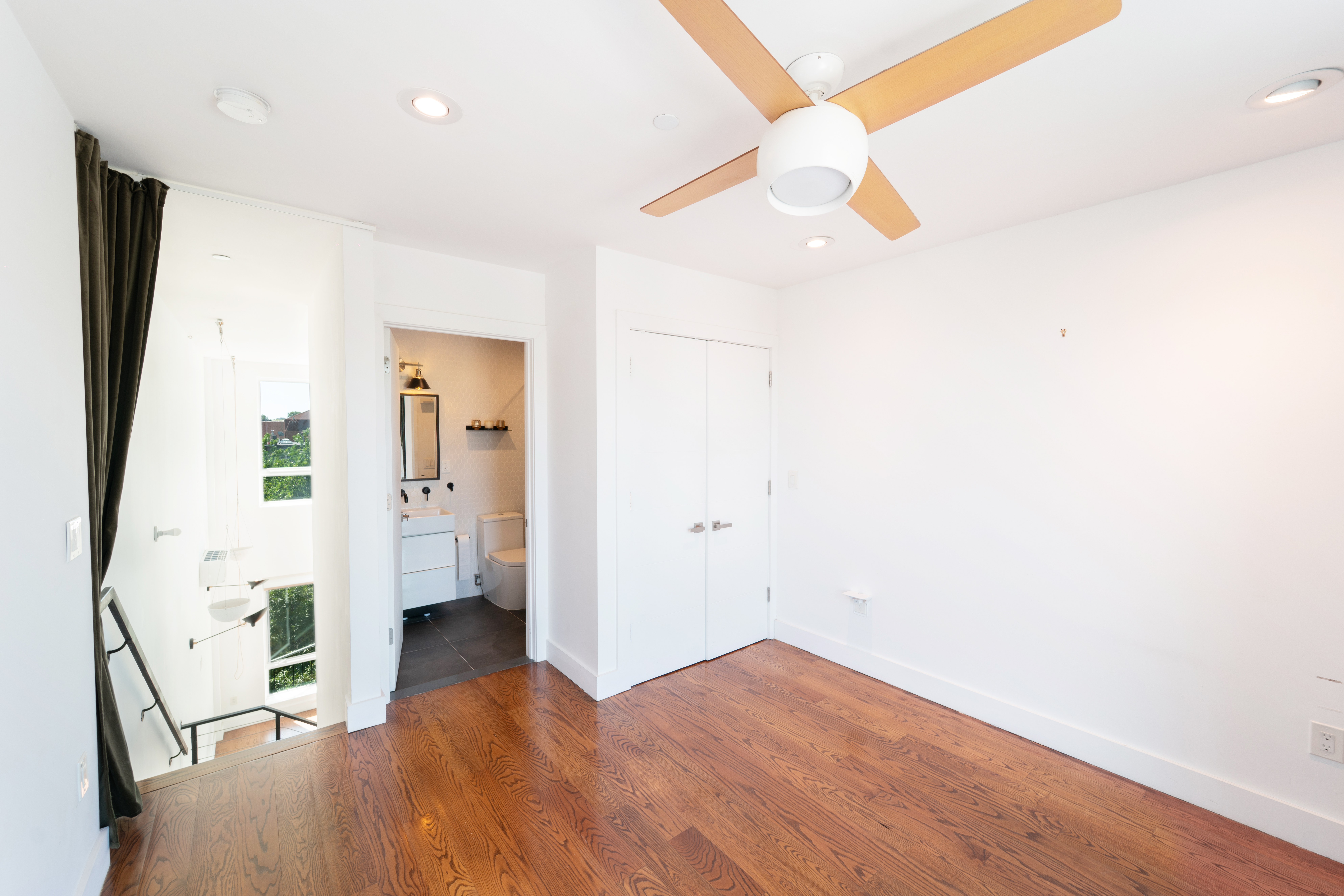 299 Van Buren Street, Unit 4C Brooklyn, NY 11221 - Photo 12 of 16 a view of empty room with wooden floor