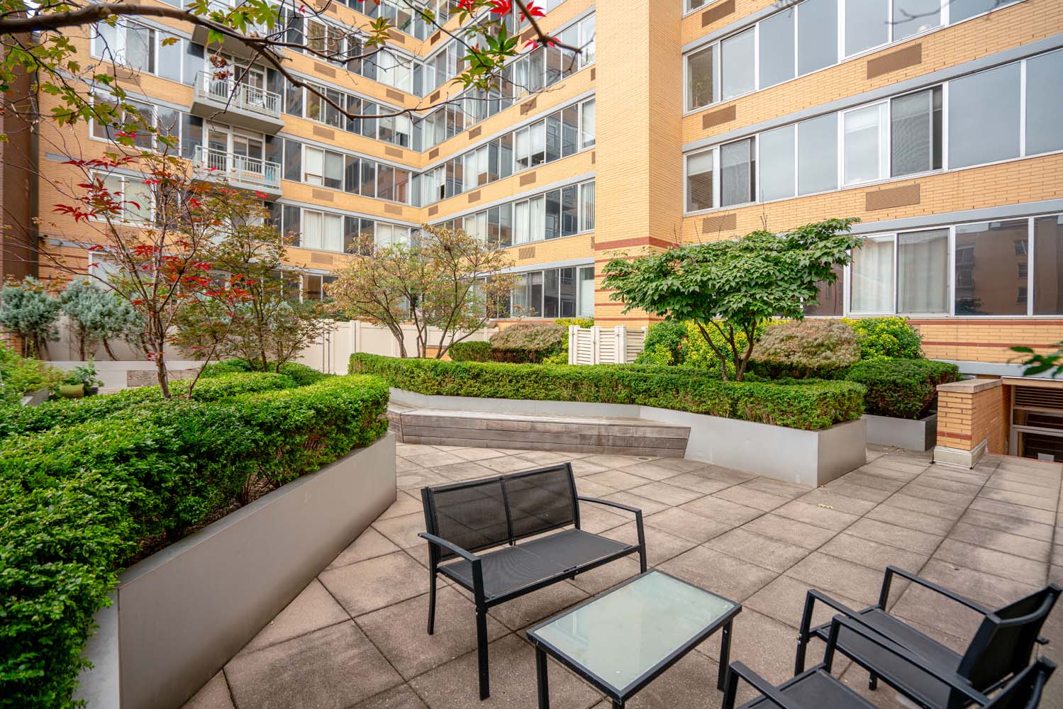 301 West 118th Street, Unit 8A Manhattan, NY 10026 - Photo 12 of 15 a front view of a building with garden