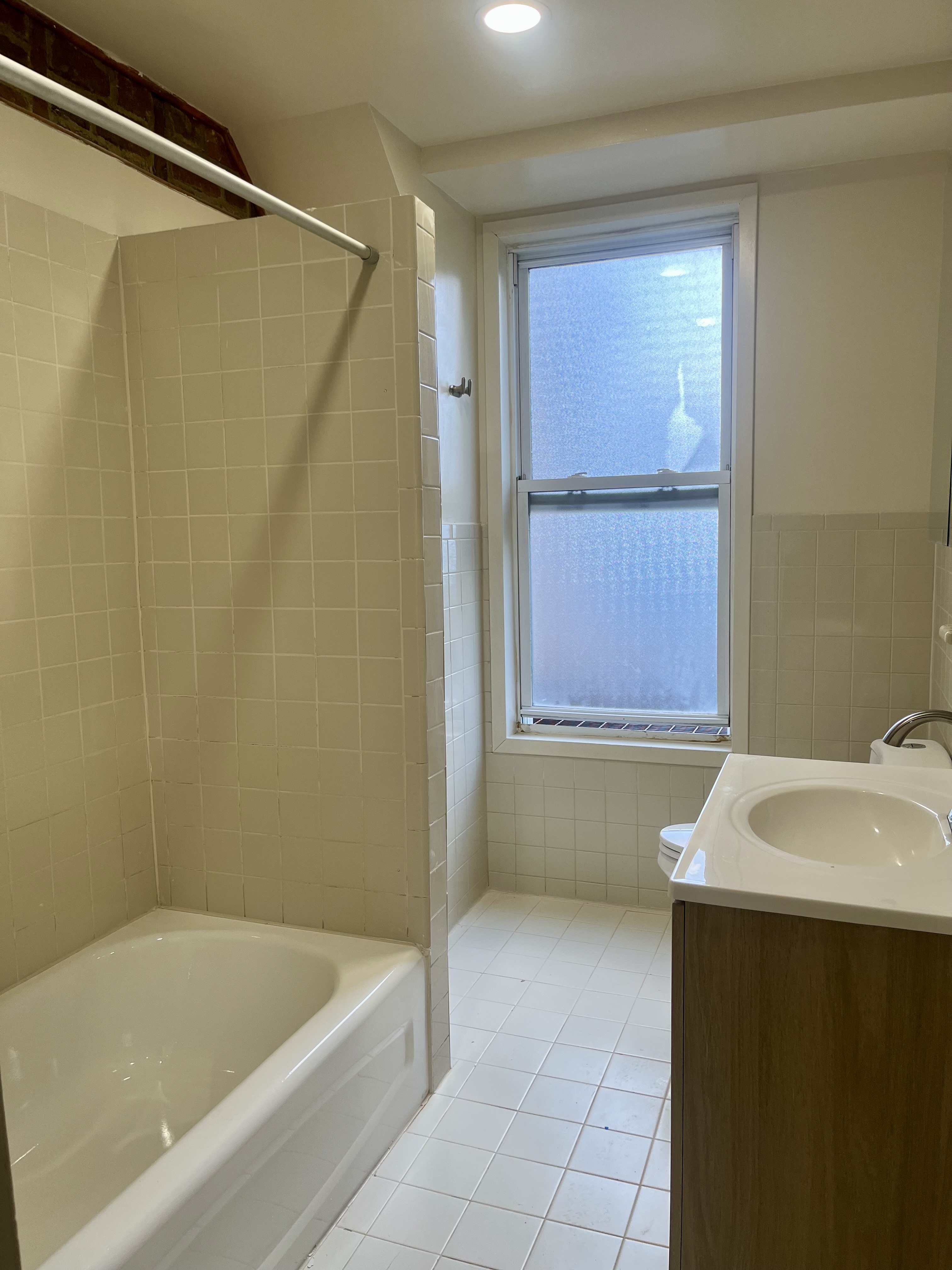 226 10th Street, Unit 3 Brooklyn, NY 11215 - Photo 9 of 10 a bathroom with a bathtub and a sink