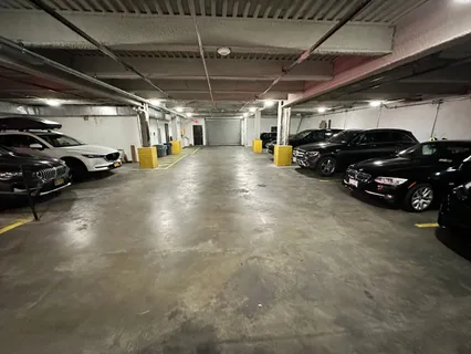 a view of parking garage with cars