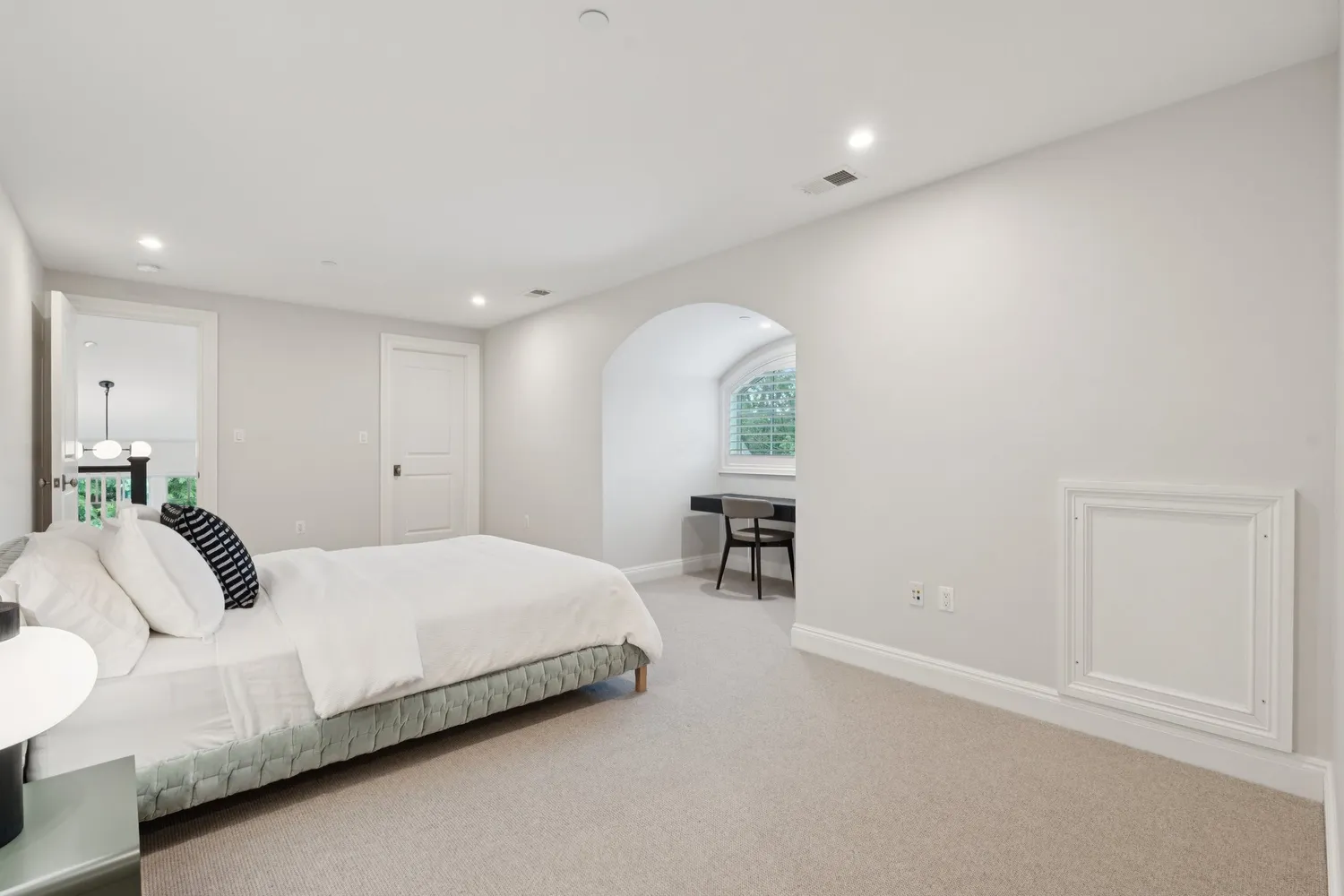 a dining room with a table chairs and a open kitchen view