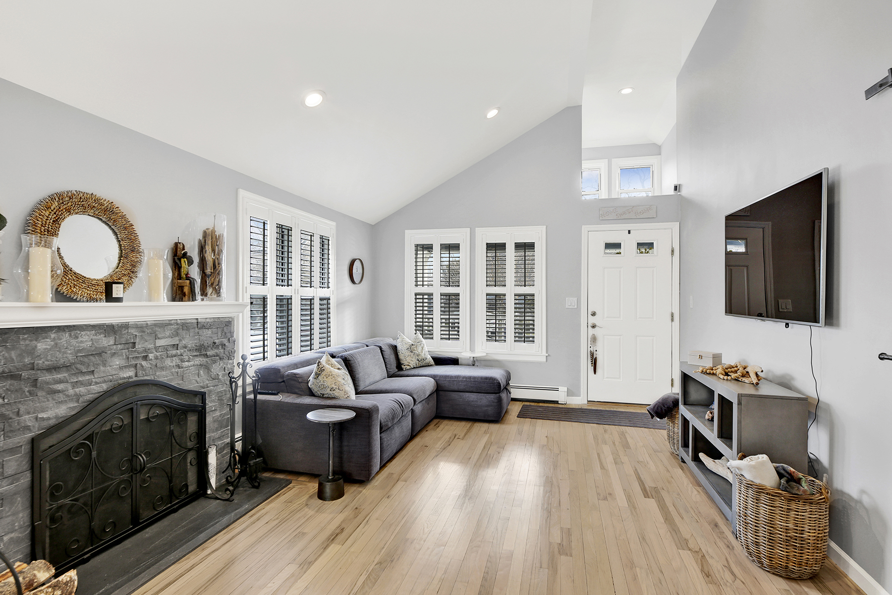 4-53 Beach 142nd Street Queens, NY 11694 - Photo 8 of 39 a living room with furniture and a fireplace