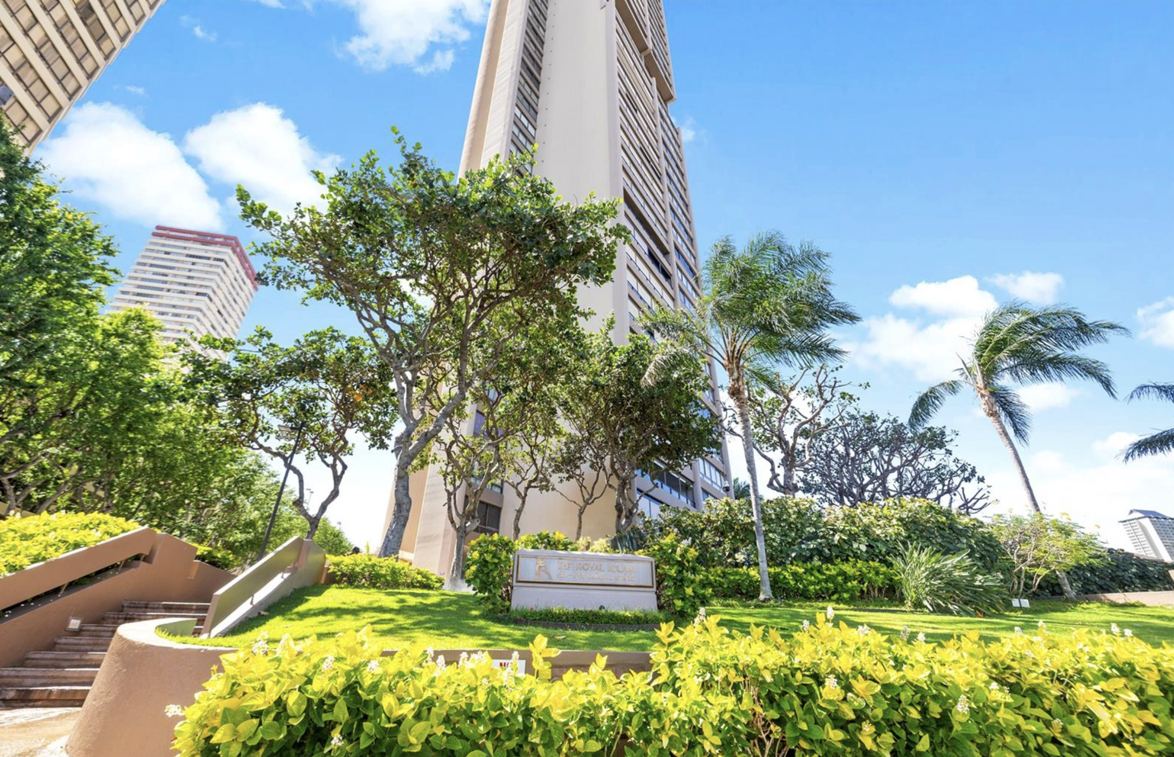 583 Kamoku Street, Unit 1907 Honolulu, HI 96826 - Photo 1 of 1 a front view of a house with a yard and fountain
