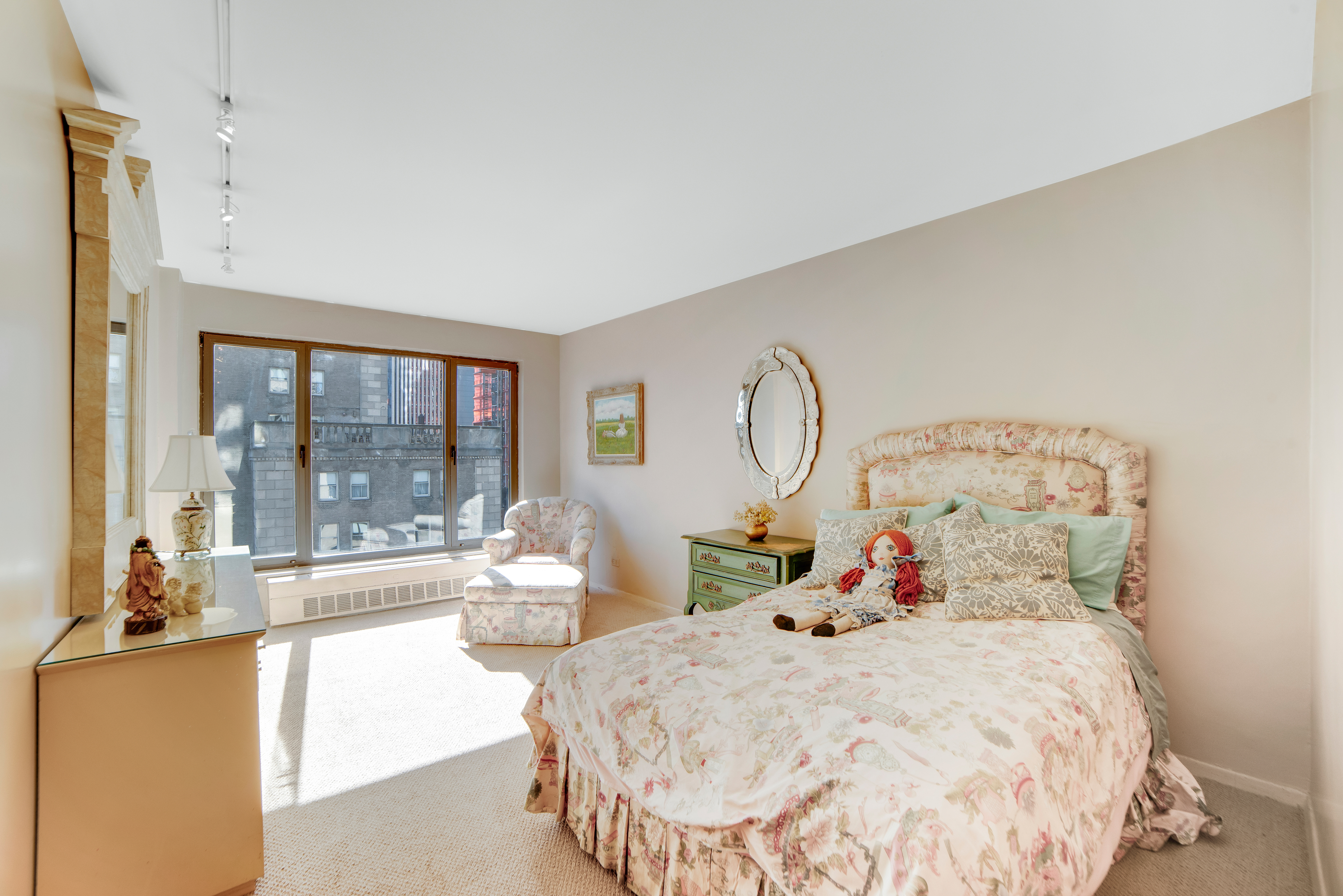 200 Central Park South, Unit 24A Manhattan, NY 10019 - Photo 18 of 23 a bed room with two beds and large windows