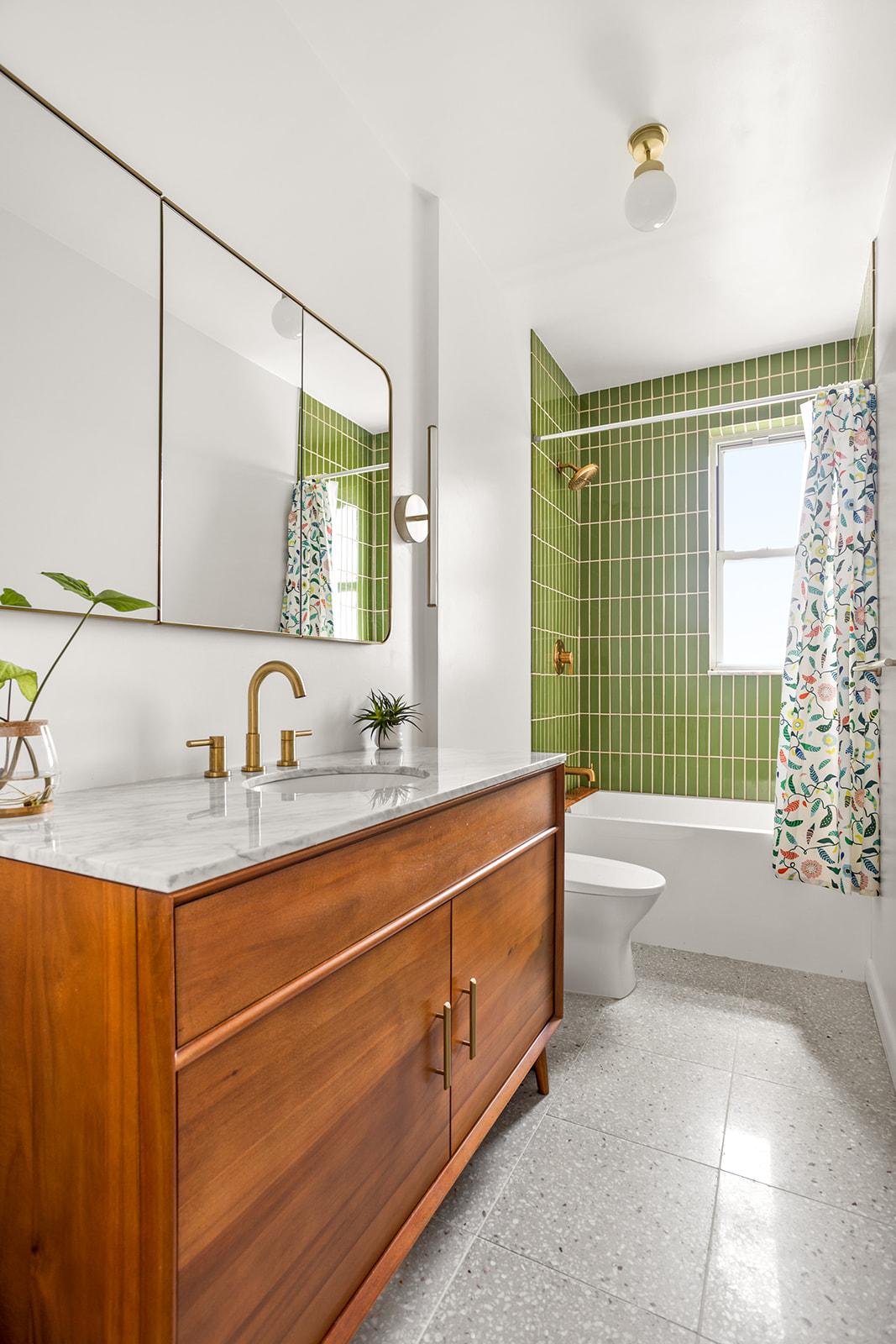 35-14 77th Street, Unit 52 Queens, NY 11372 - Photo 6 of 11 a bathroom with a granite countertop sink mirror toilet and bathtub