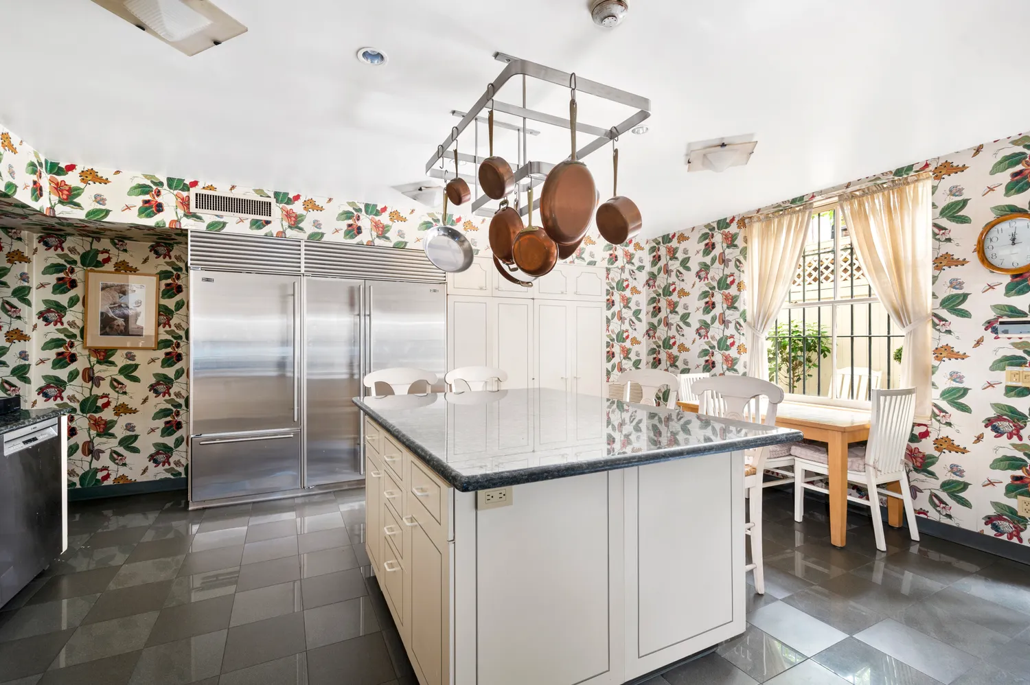 a dining room with furniture and chandelier