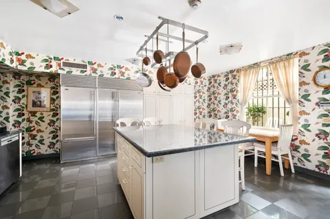 a dining room with furniture and chandelier