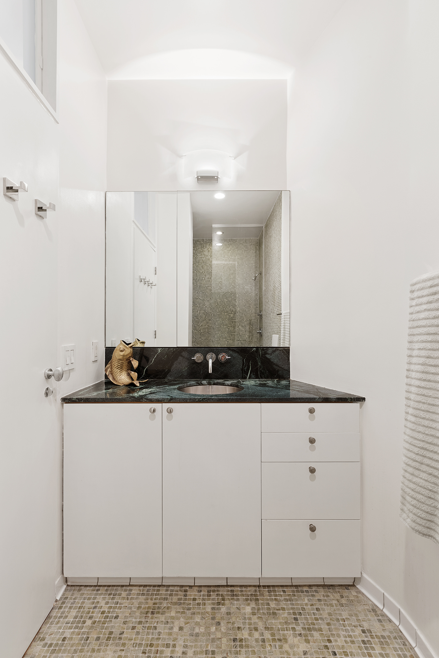 100 Hudson Street, Unit 4D Manhattan, NY 10013 - Photo 10 of 13 a bathroom with a sink and a mirror