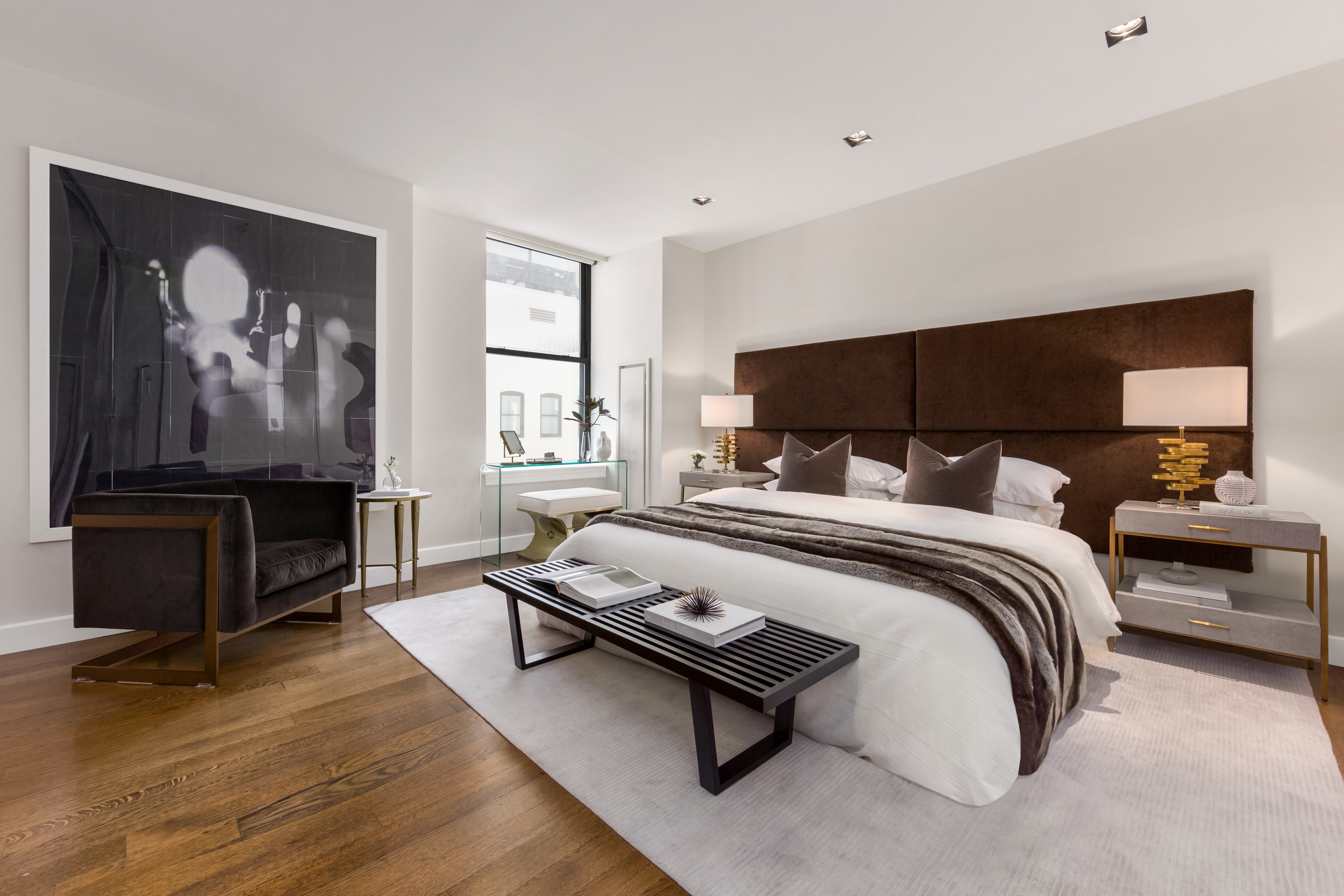 225 5th Avenue, Unit PHY Manhattan, NY 10010 - Photo 7 of 10 a bedroom with a bed and wooden floor