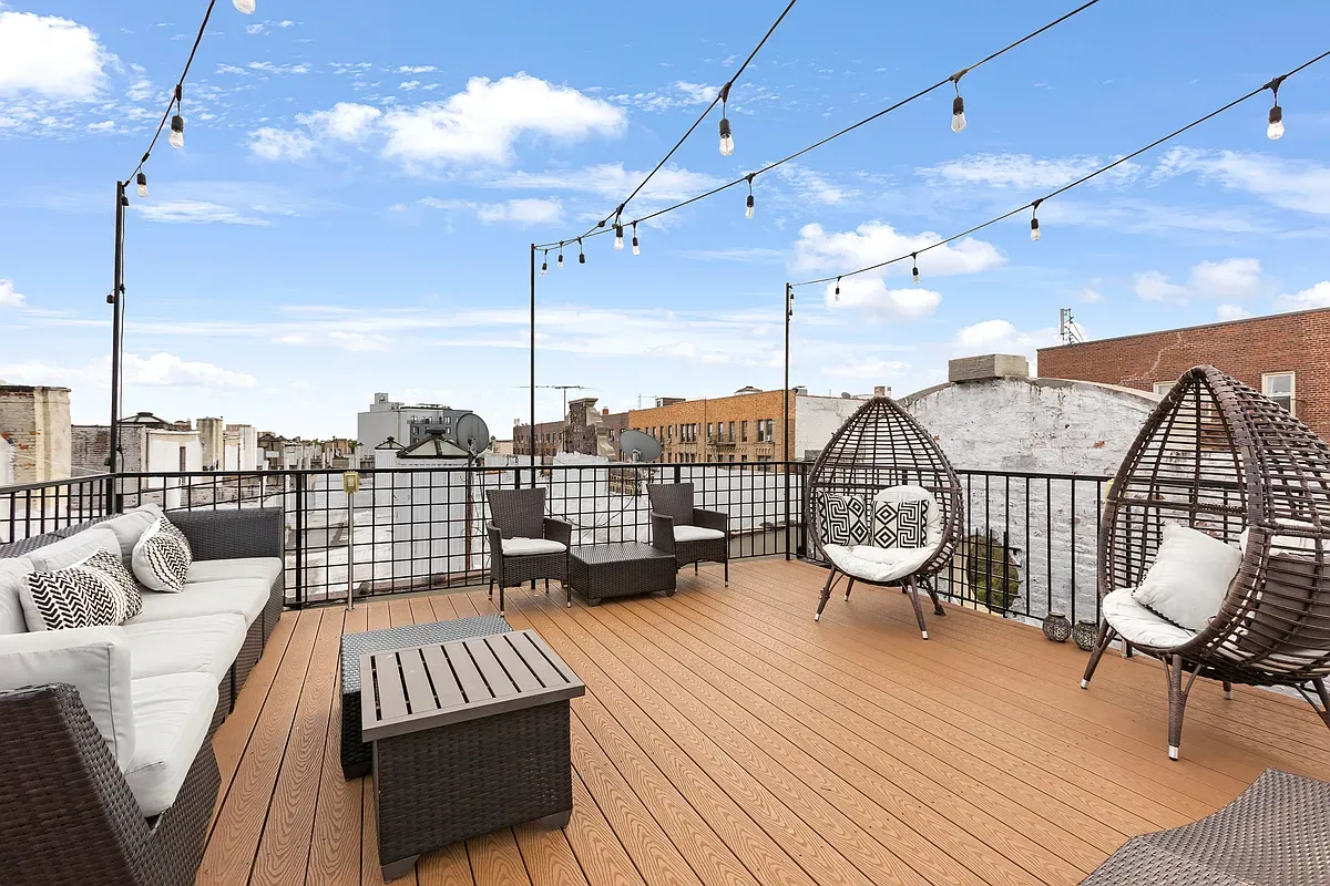 a view of a balcony with wooden floor