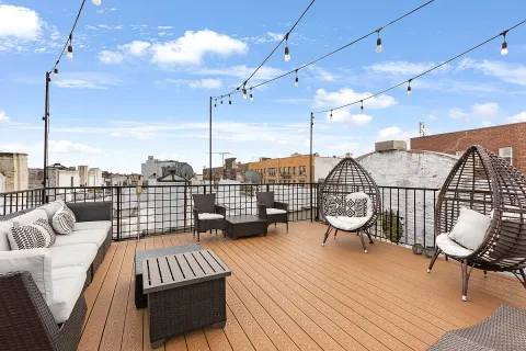 a view of a balcony with wooden floor
