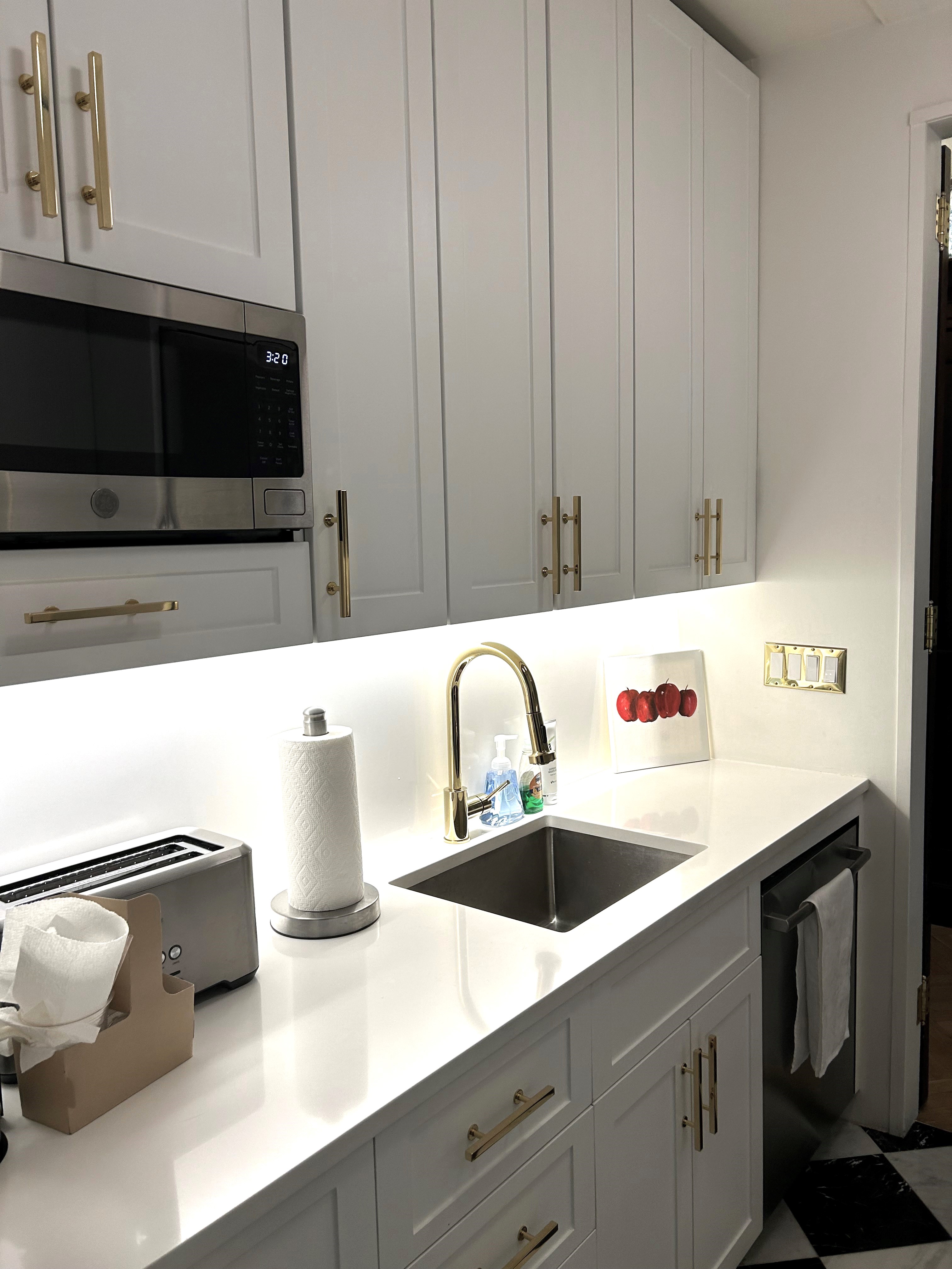 36 East 69th Street, Unit 2AB Manhattan, NY 10021 - Photo 15 of 26 a kitchen with a sink and a stove top oven