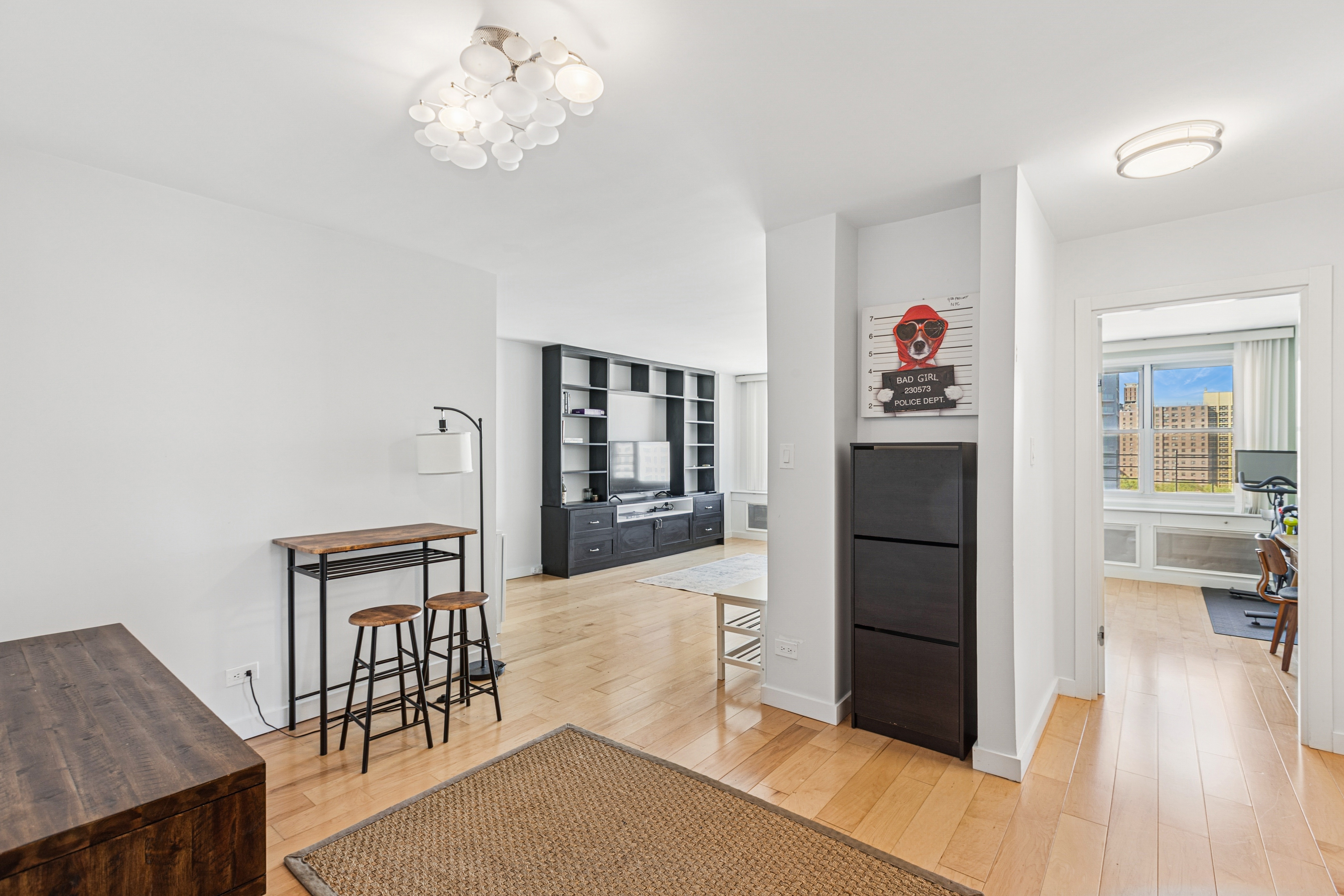 1270 5th Avenue, Unit 12C Manhattan, NY 10029 - Photo 3 of 18 a view of livingroom with furniture and wooden floor
