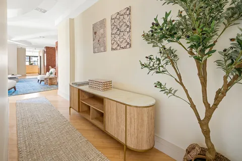 a spacious bathroom with a double vanity sink and a mirror