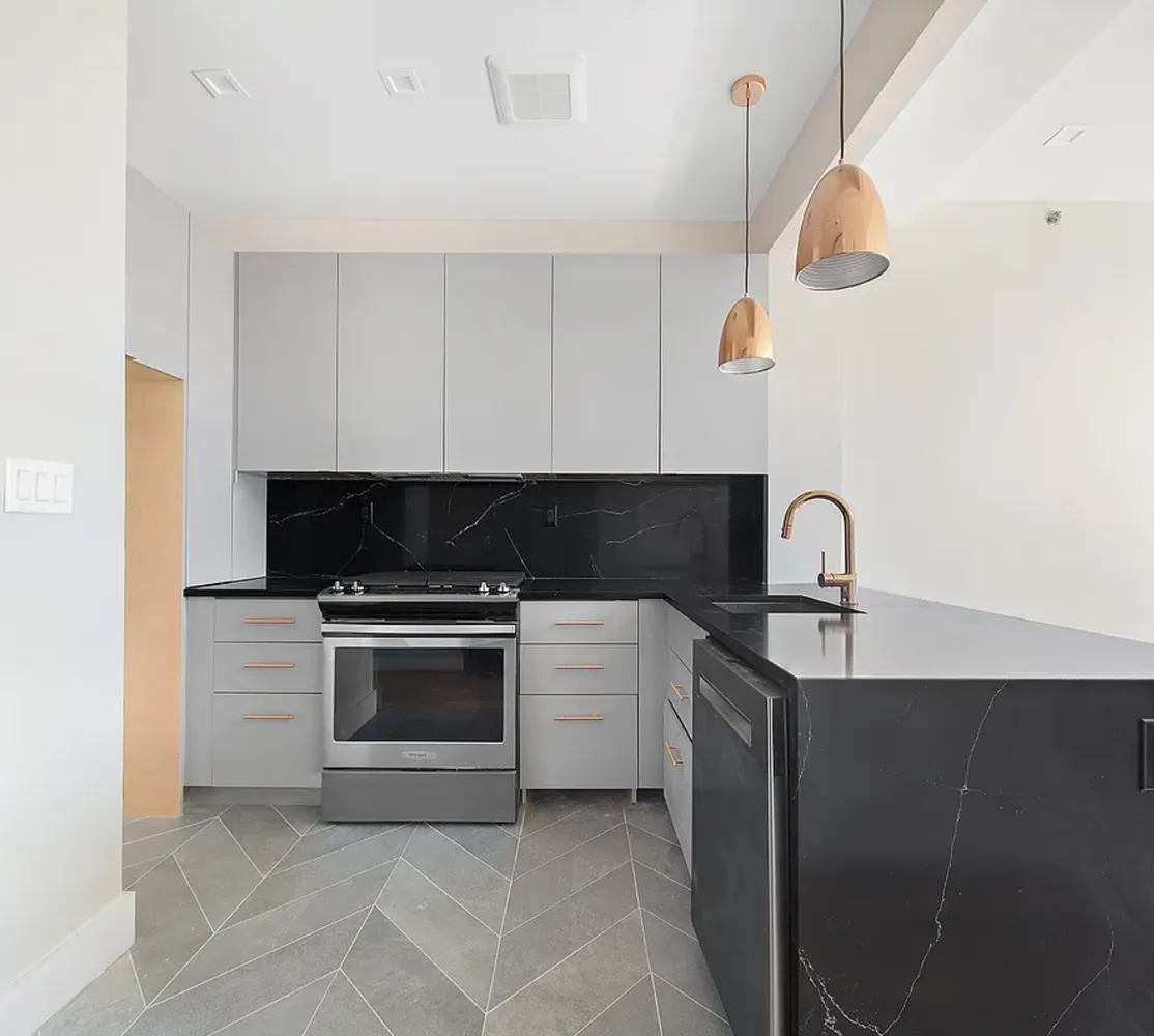 a kitchen with a sink and a stove