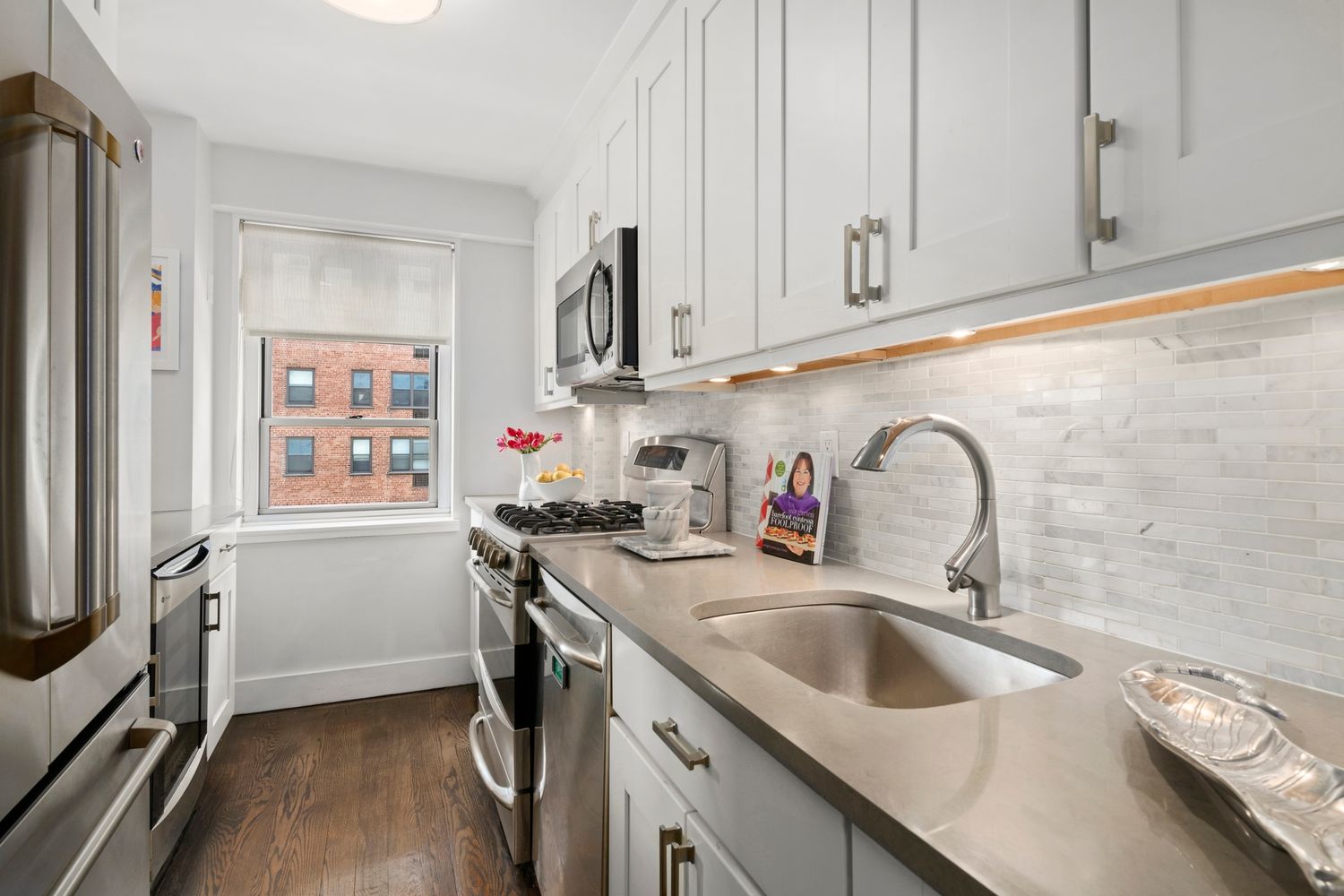 a view of a room with wooden floor and closet