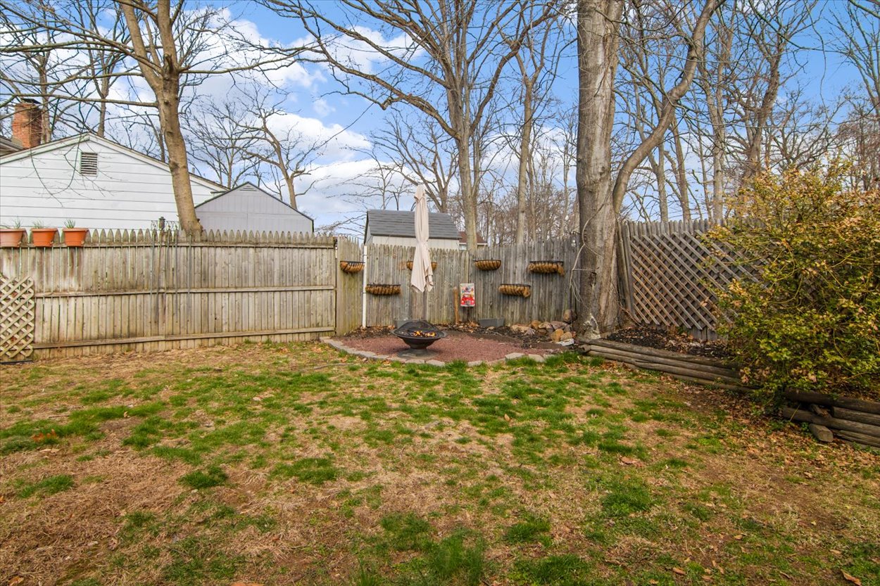 107 Kingston Road Parsippany, NJ 07054 - Photo 33 of 43 a view of a yard with a house and a tree