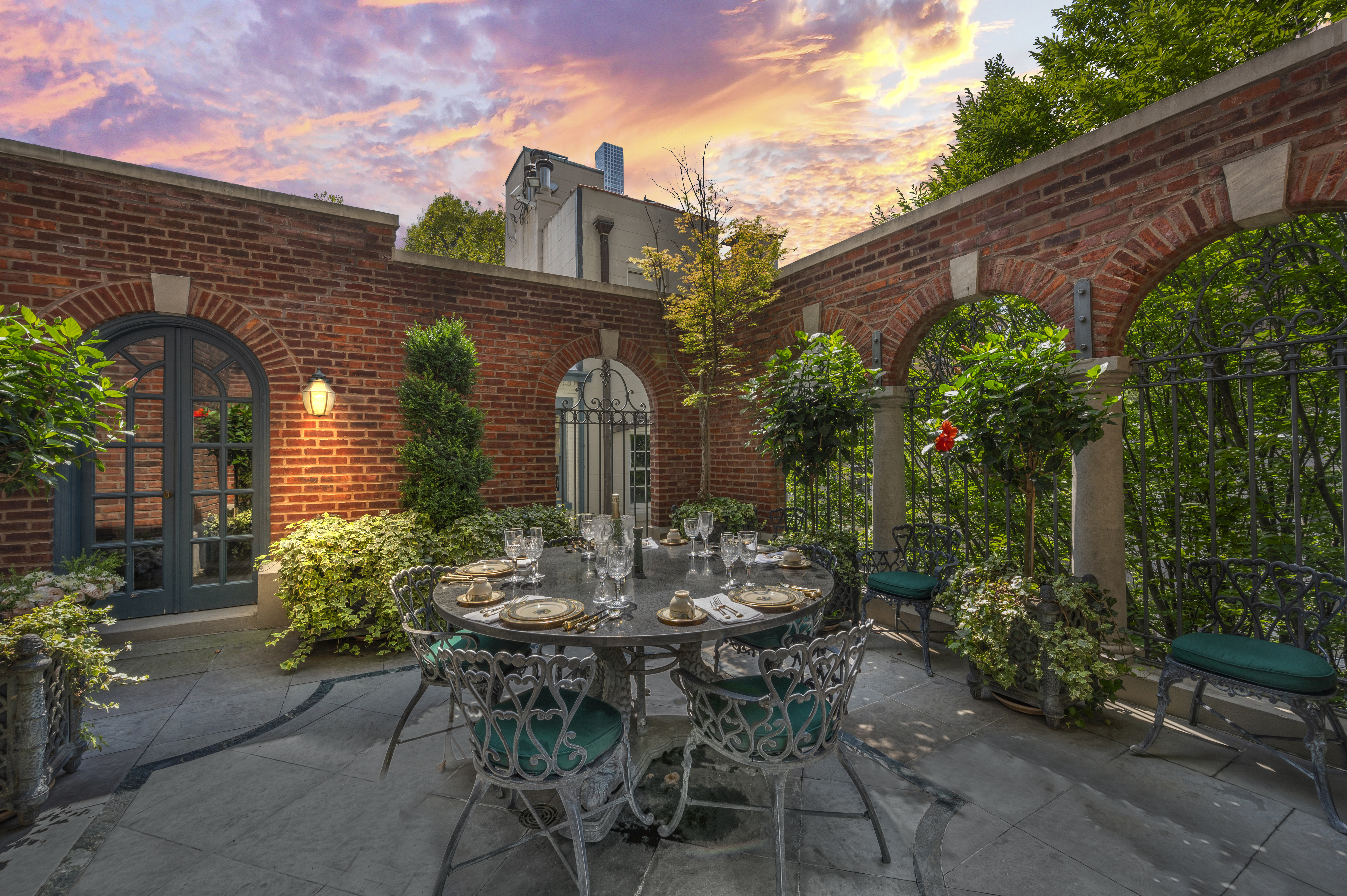 163 East 64th Street Manhattan, NY 10065 - Photo 29 of 34 a view of a patio with table and chairs and potted plants
