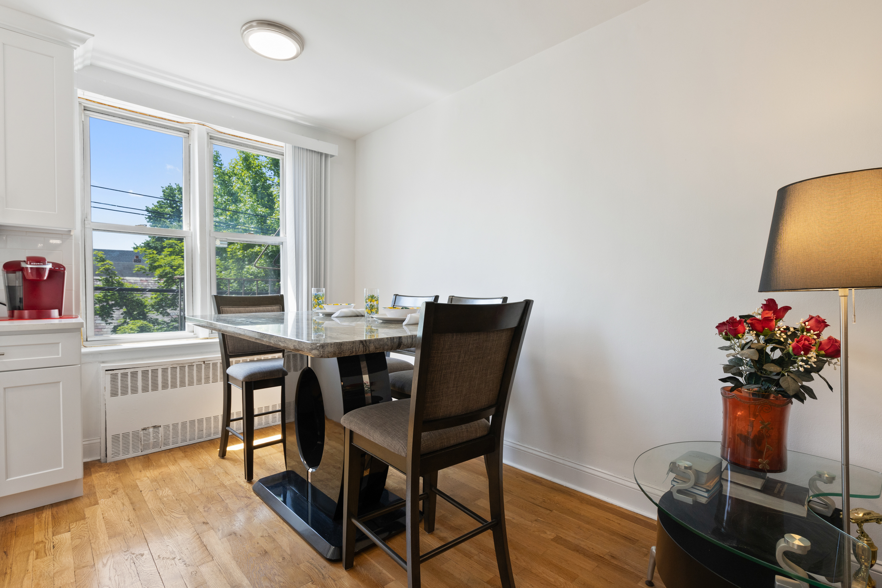 205 East 238th Street, Unit 2C Bronx, NY 10470 - Photo 5 of 14 a view of a dining room with furniture and a window