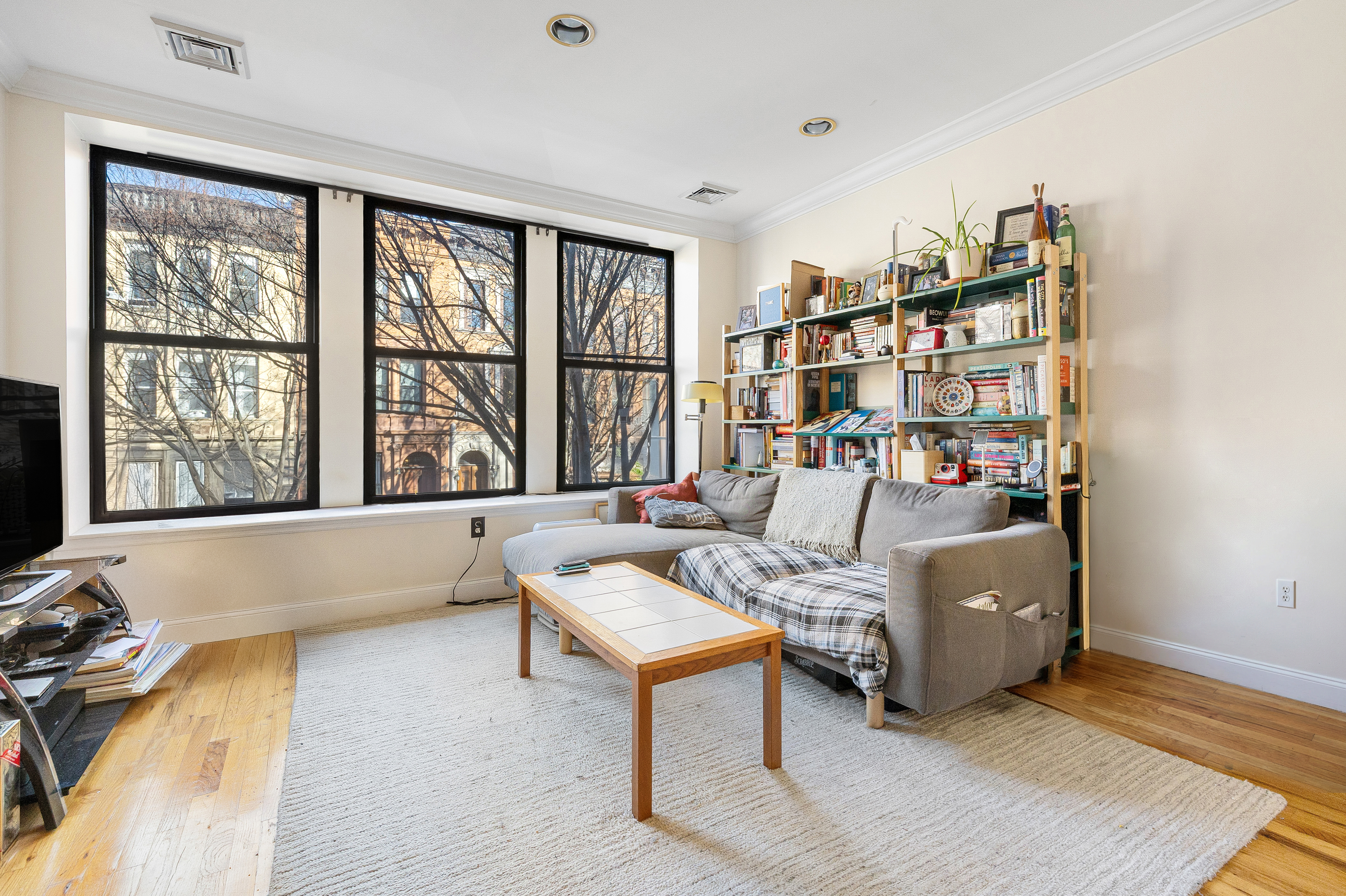 518 West 149th Street Manhattan, NY 10031 - Photo 15 of 23 a living room with furniture and a large window