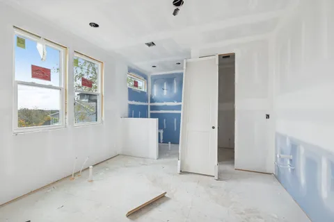 a view of an empty room with a window