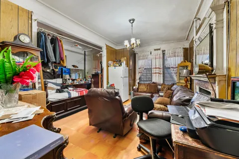 a city street with tall building next to a road