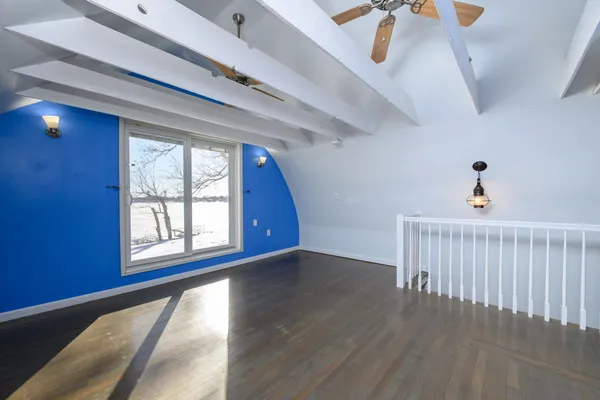 a view of an entryway with wooden floor