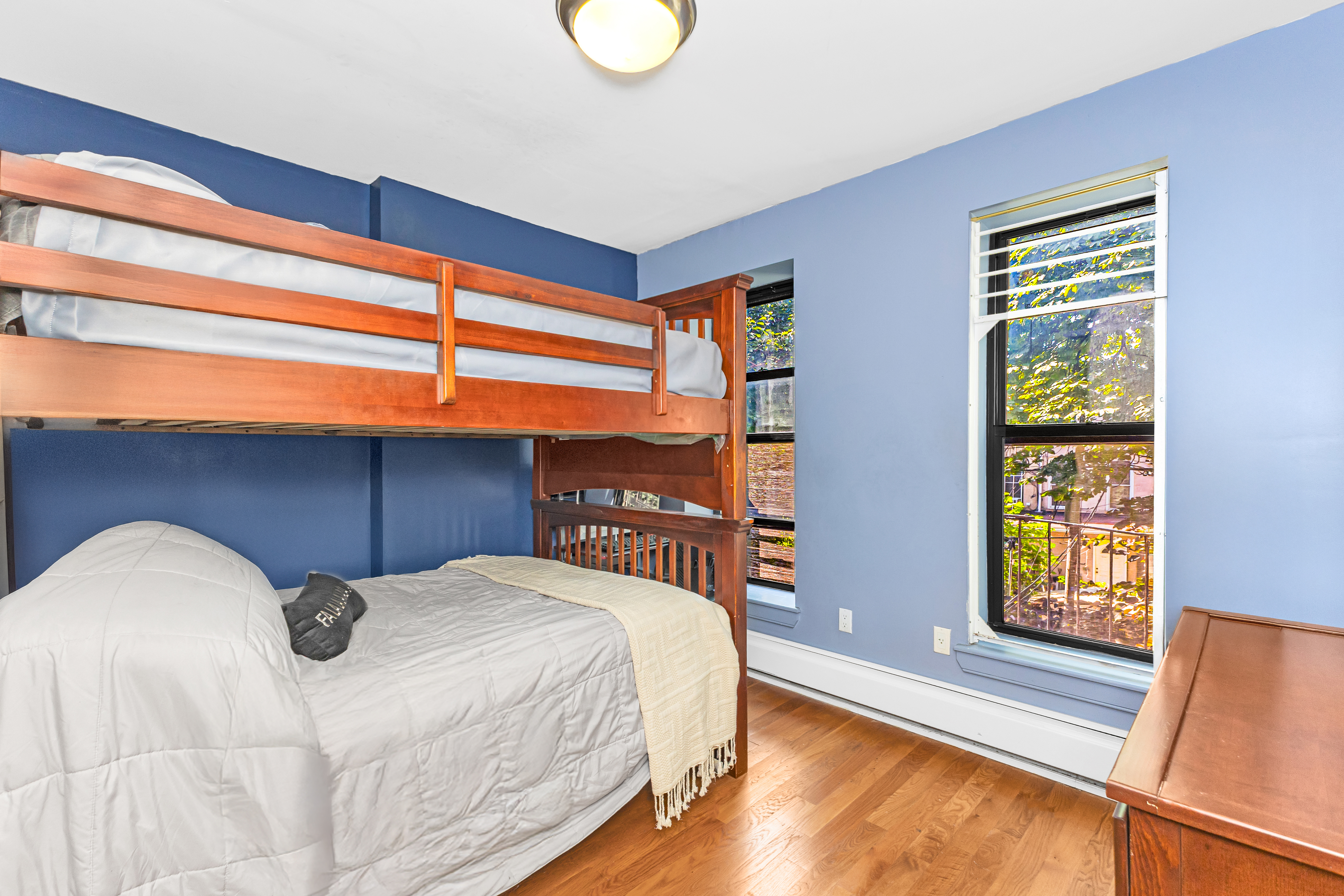 786 Madison Street, Unit 3B Brooklyn, NY 11221 - Photo 3 of 11 a bedroom with a bed and a window