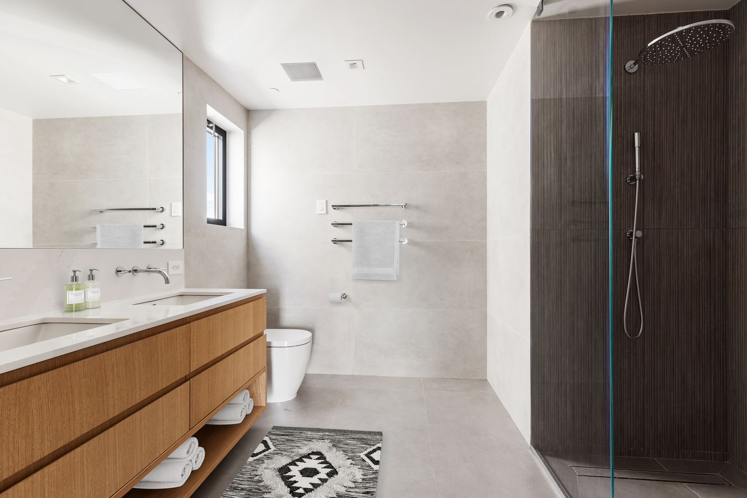 96 North 1st Street, Unit 3A Brooklyn, NY 11249 - Photo 8 of 13 a bathroom with a double vanity sink toilet and shower