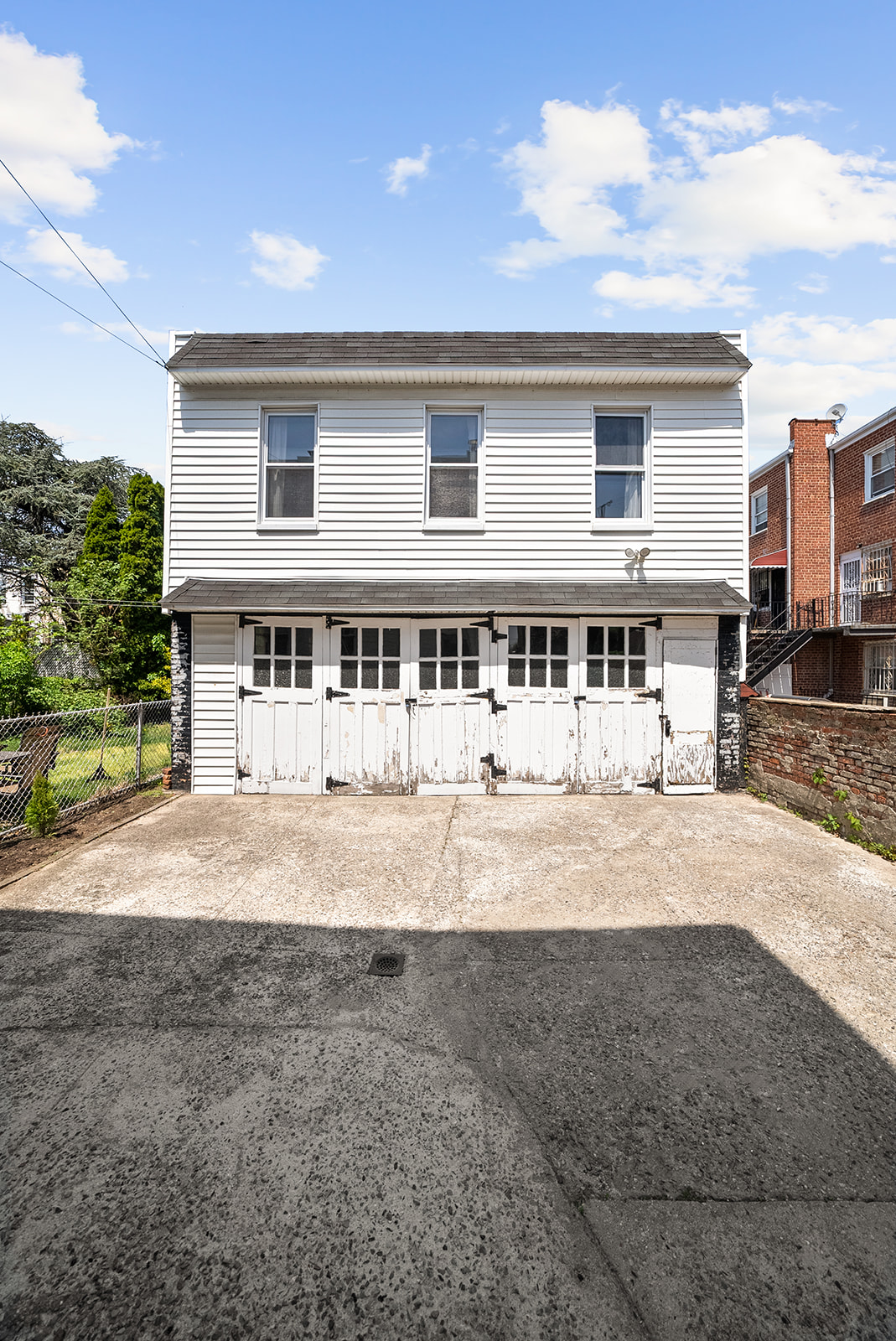 59-45 Palmetto Street Queens, NY 11385 - Photo 21 of 25 a front view of a house with a yard