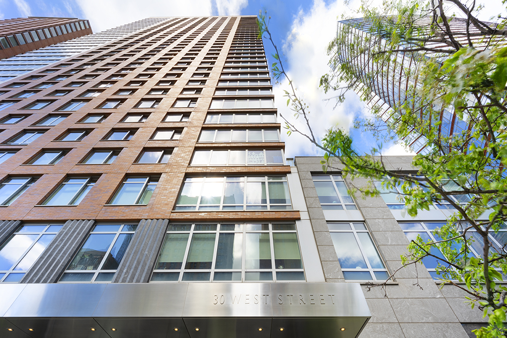 30 West Street, Unit 21AB Manhattan, NY 10004 - Photo 16 of 17 a front view of a multi story building