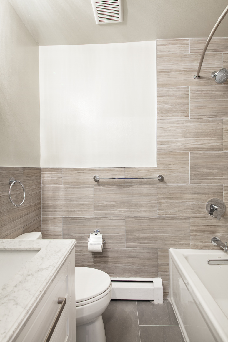 442 Amsterdam Avenue, Unit 4C Manhattan, NY 10024 - Photo 5 of 9 a bathroom with a sink a toilet and shower