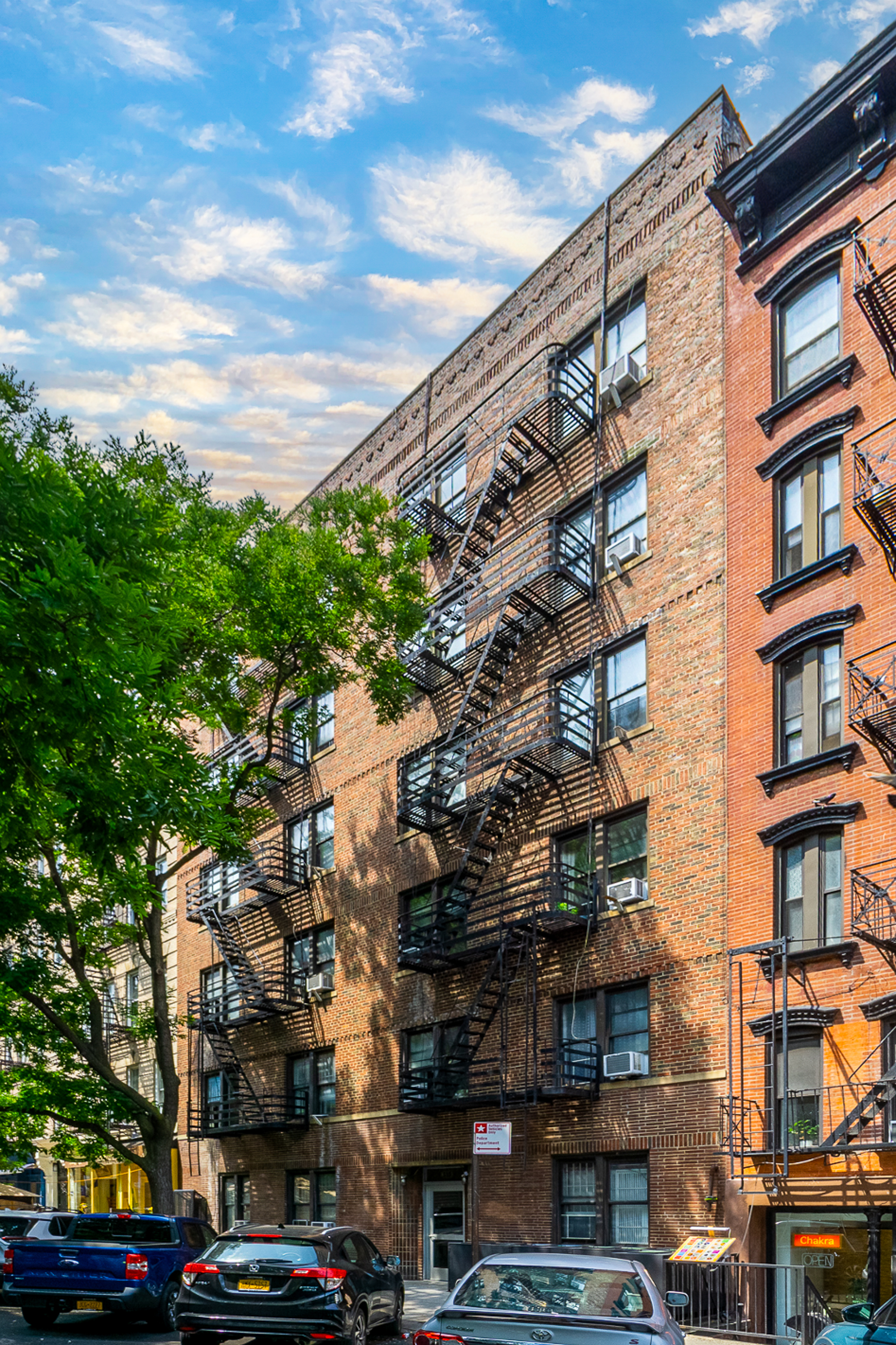 315 East 5th Street, Unit 5D Manhattan, NY 10003 - Photo 7 of 8 a city street lined with buildings and cars