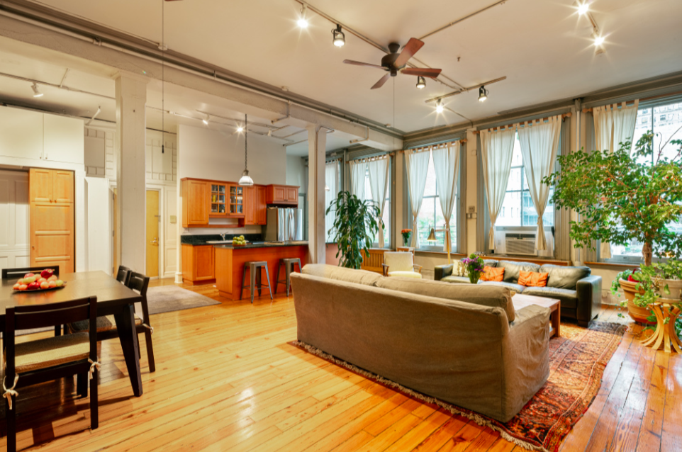 116 Franklin Street, Unit 3 Manhattan, NY 10013 - Photo 6 of 9 a living room with furniture and a large window