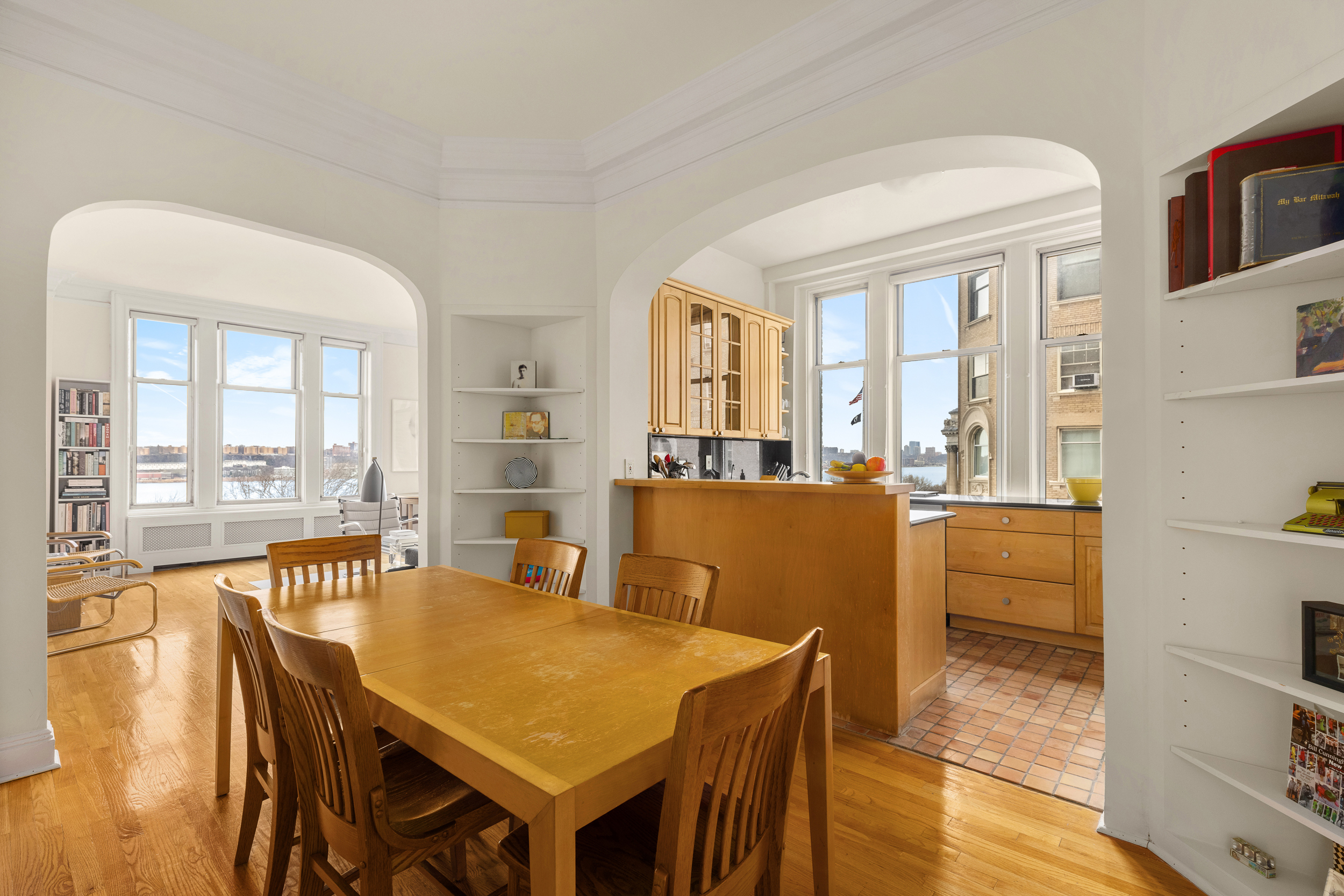 155 Riverside Drive, Unit 6B Manhattan, NY 10024 - Photo 3 of 8 a view of a dining room with furniture large windows and wooden floor