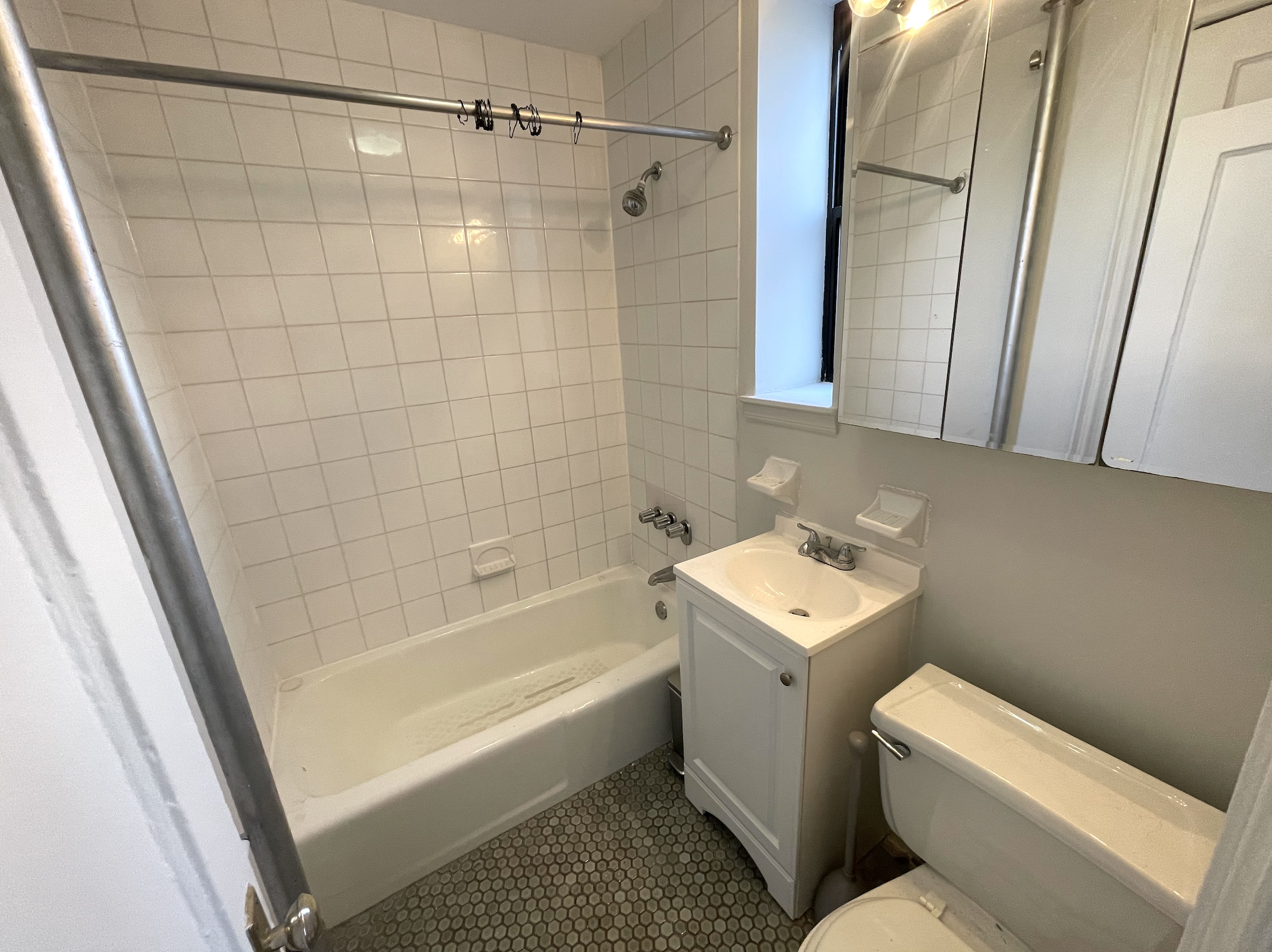 269 Prospect Place, Unit 6A Brooklyn, NY 11238 - Photo 5 of 6 a bathroom with a sink a toilet and shower