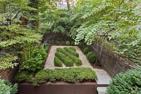 a view of statue in a garden