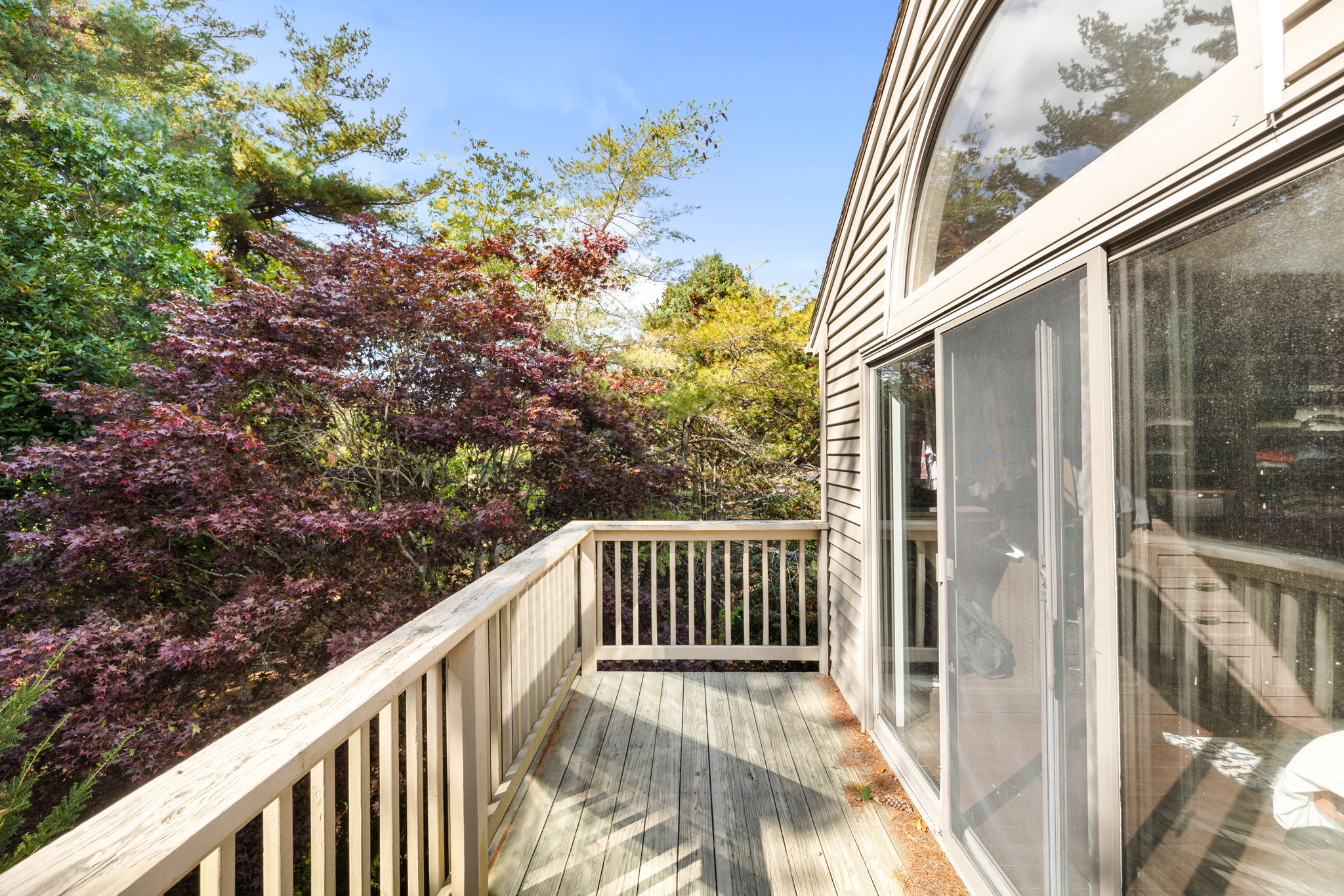 33 Thoreau Circle Beverly, MA 01915 - Photo 11 of 20 a view of a balcony with wooden fence