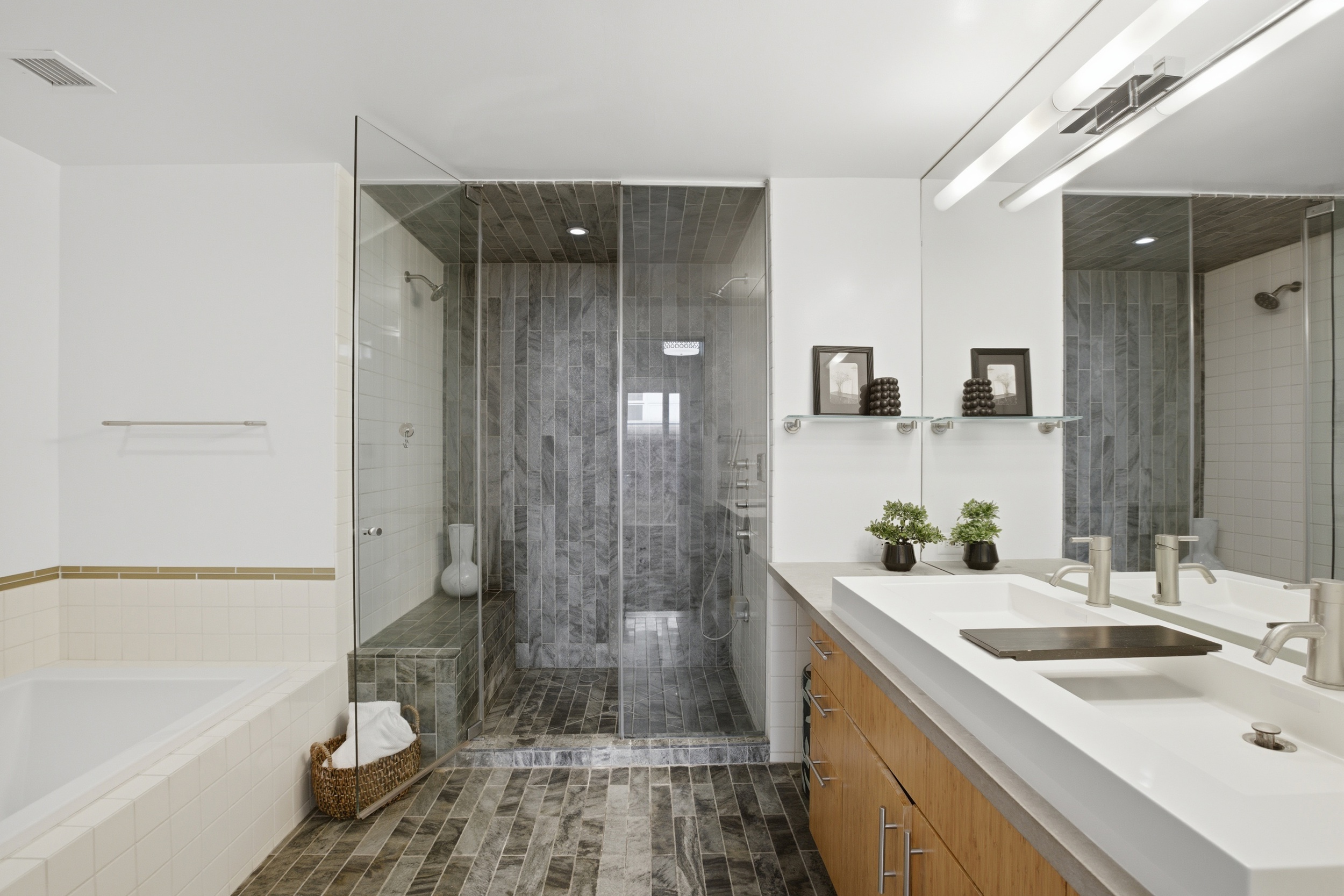 135 West 4th Street, Unit 2W Manhattan, NY 10012 - Photo 14 of 20 a bathroom with a sink a toilet and shower