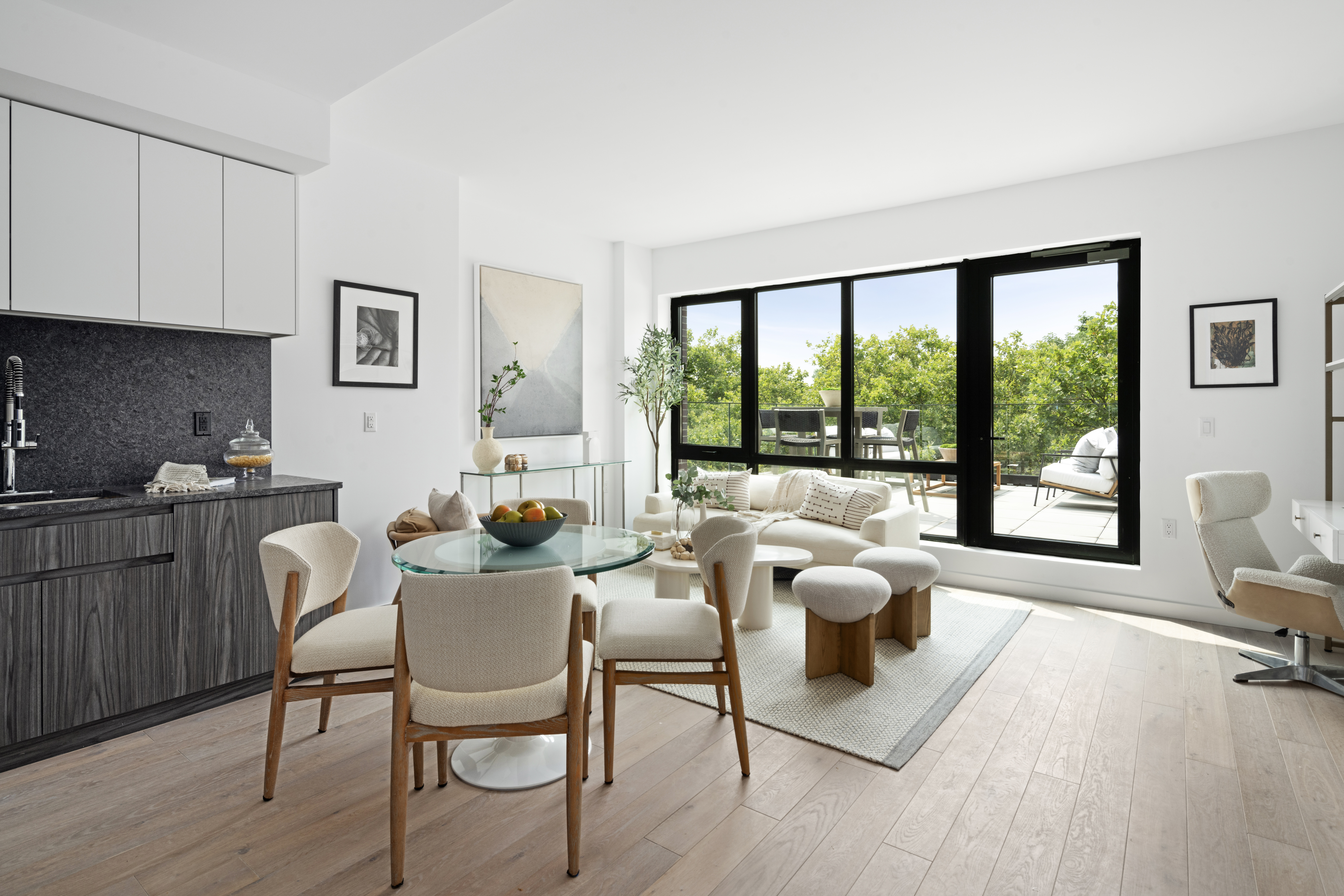 435 Tompkins Avenue, Unit PH505 Brooklyn, NY 11216 - Photo 3 of 14 a living room with furniture and a large window